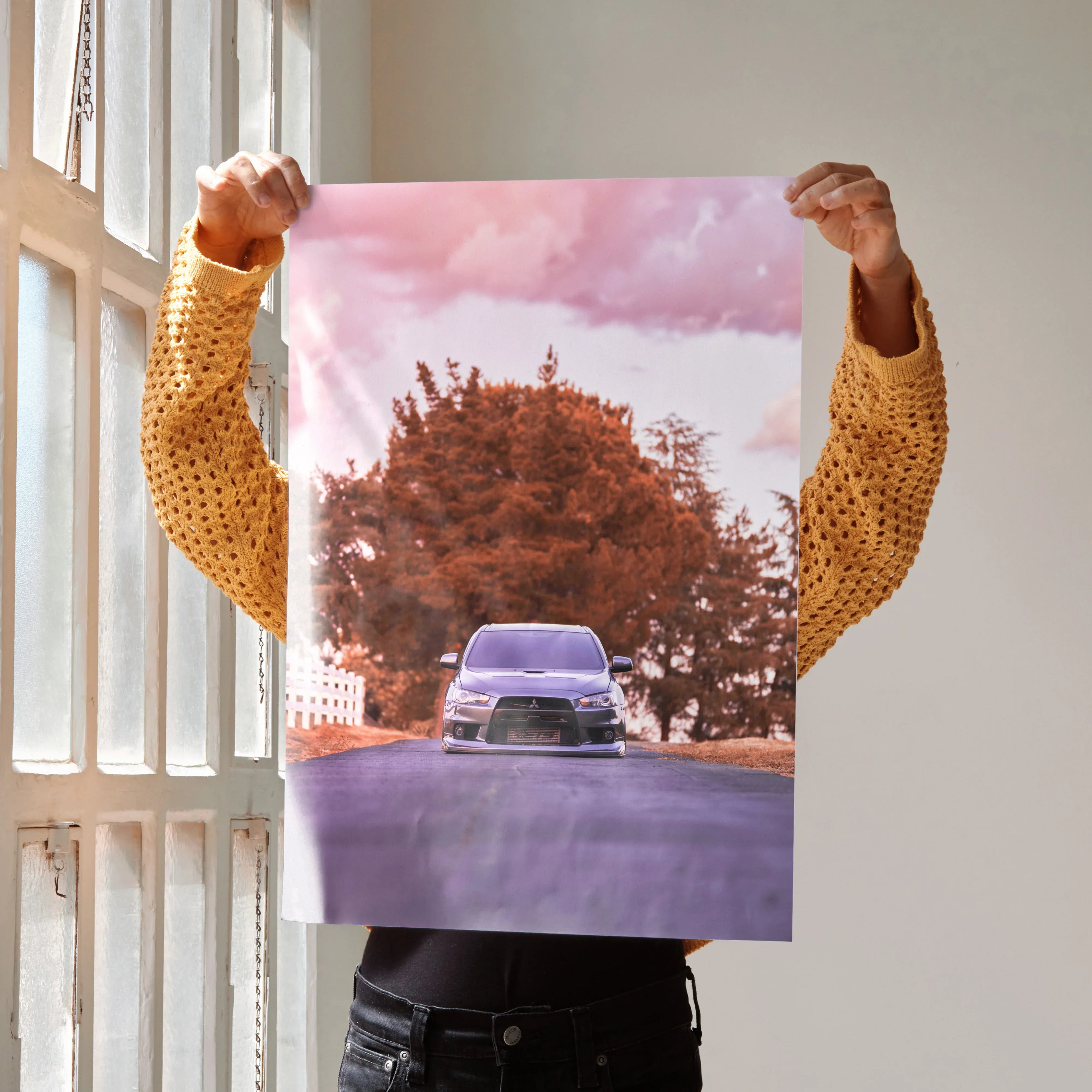 Mitsubishi Evo 10 poster showing front view of car with autumn tree and pink sky wall art.