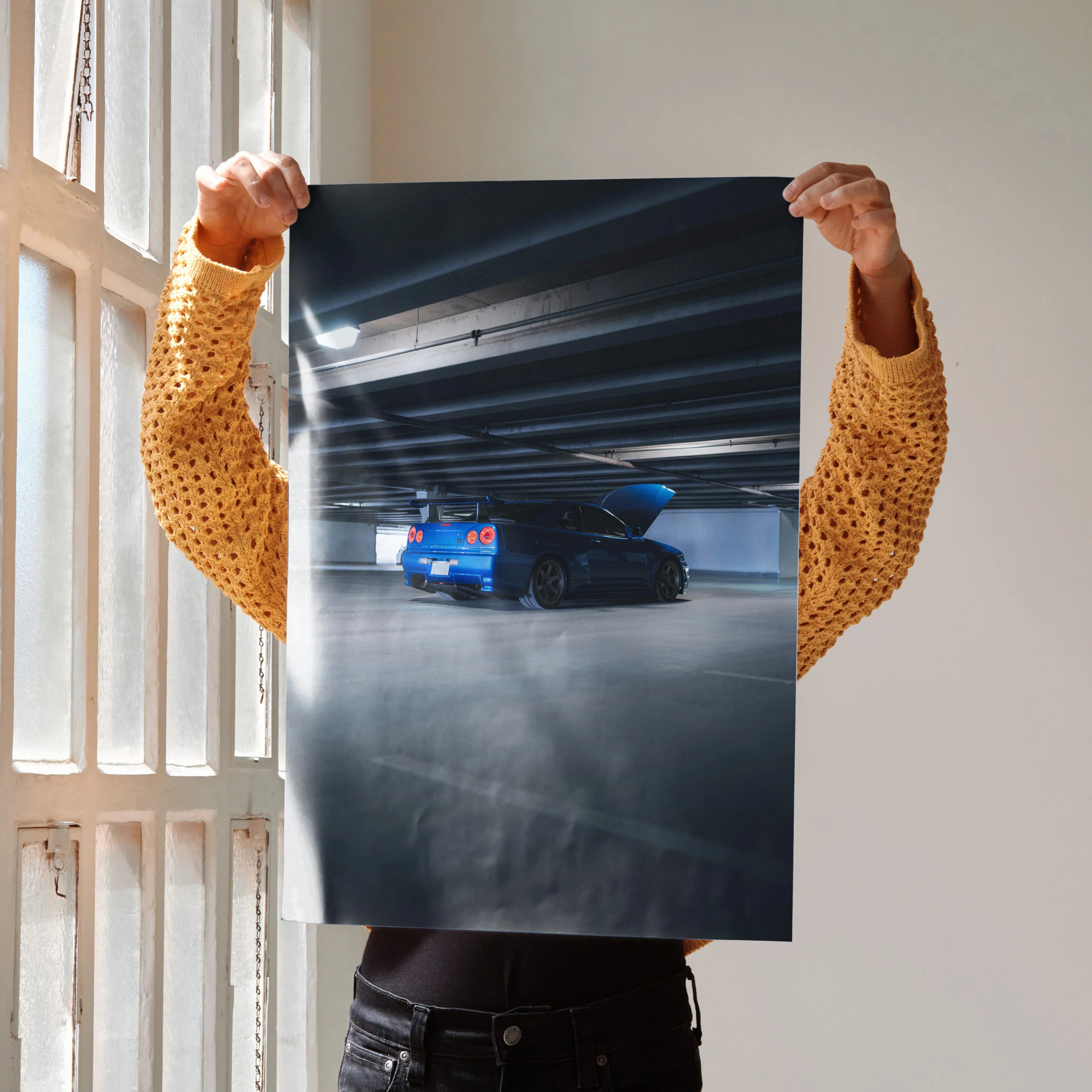 Nissan R34 GTR Skyline in blue parked in dark urban setting poster wall art.