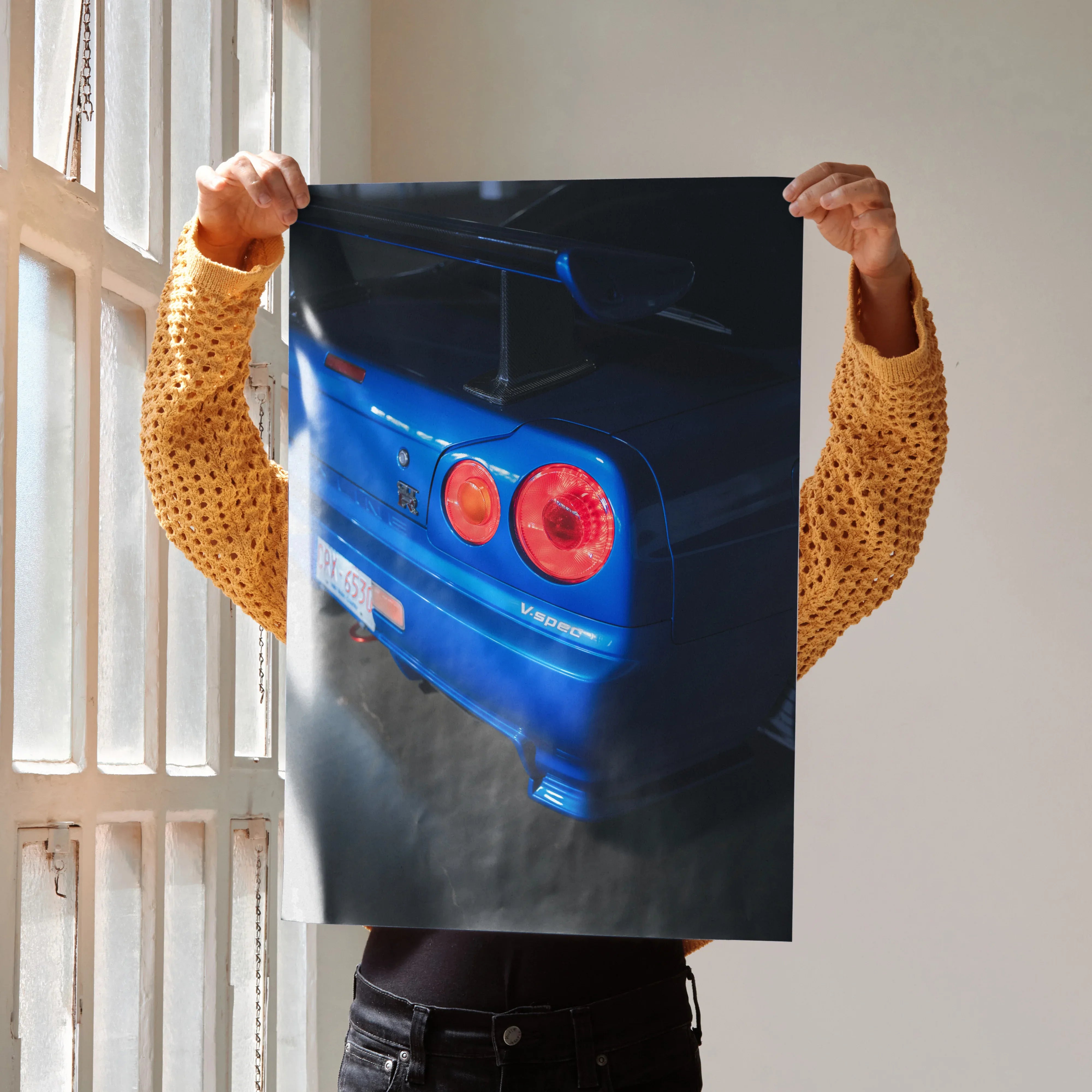 Nissan R34 GTR Skyline rear close-up in blue poster wall art with vibrant taillights.