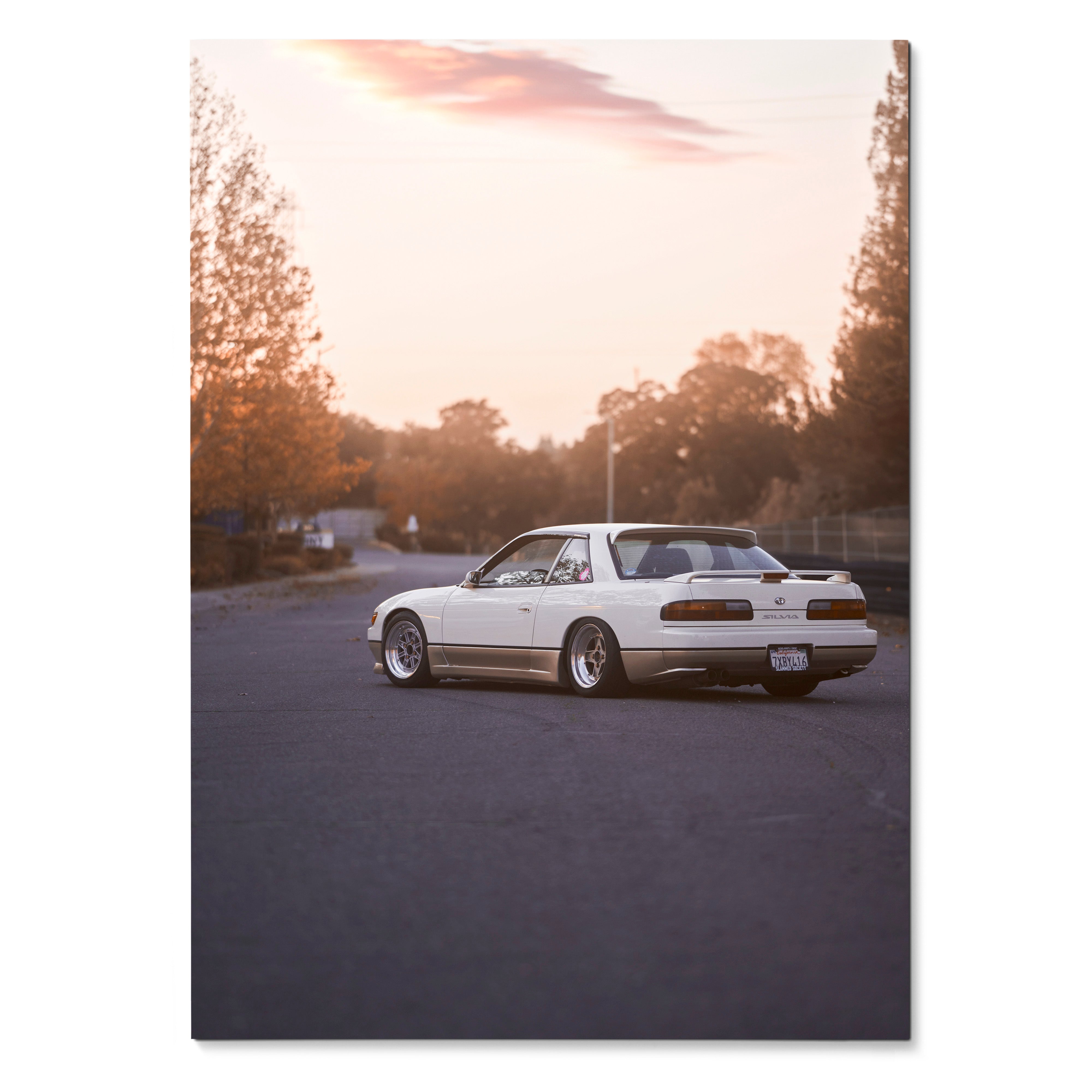 Nissan 240sx S13 Silvia parked on street at sunset poster wall art with warm tones.