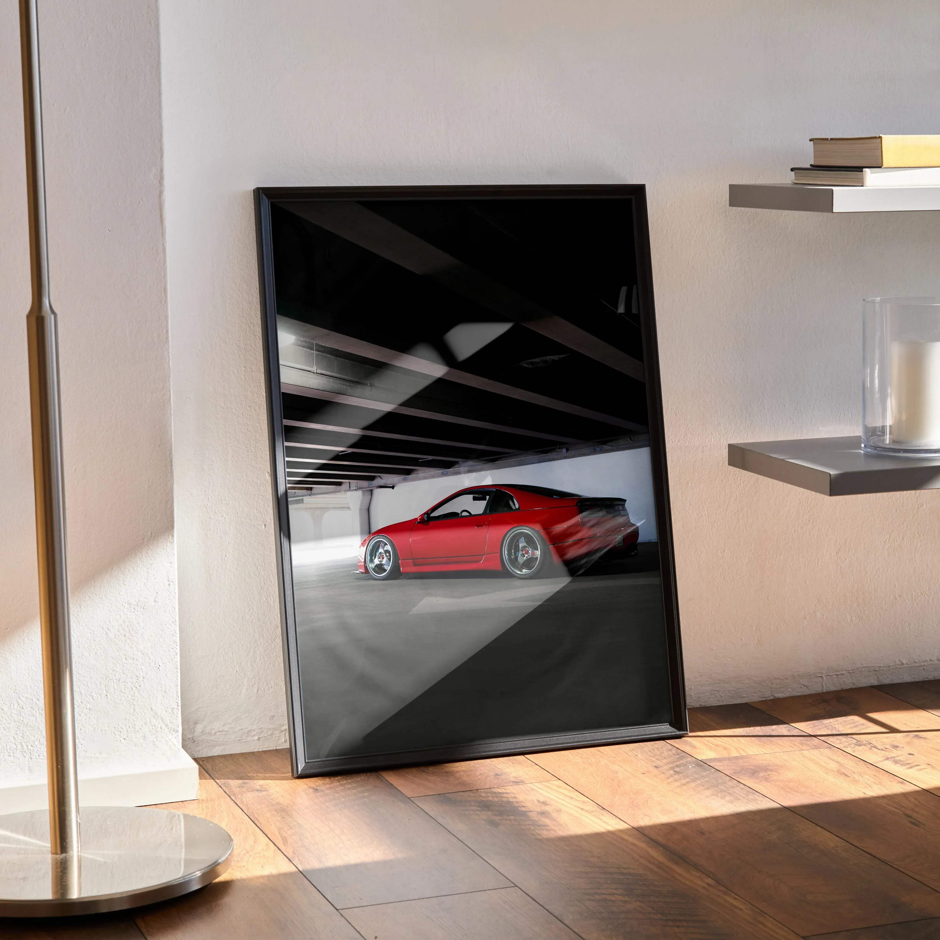 Black-framed poster featuring a vibrant red Nissan 300ZX Skyline sports car in motion inside a dimly lit garage