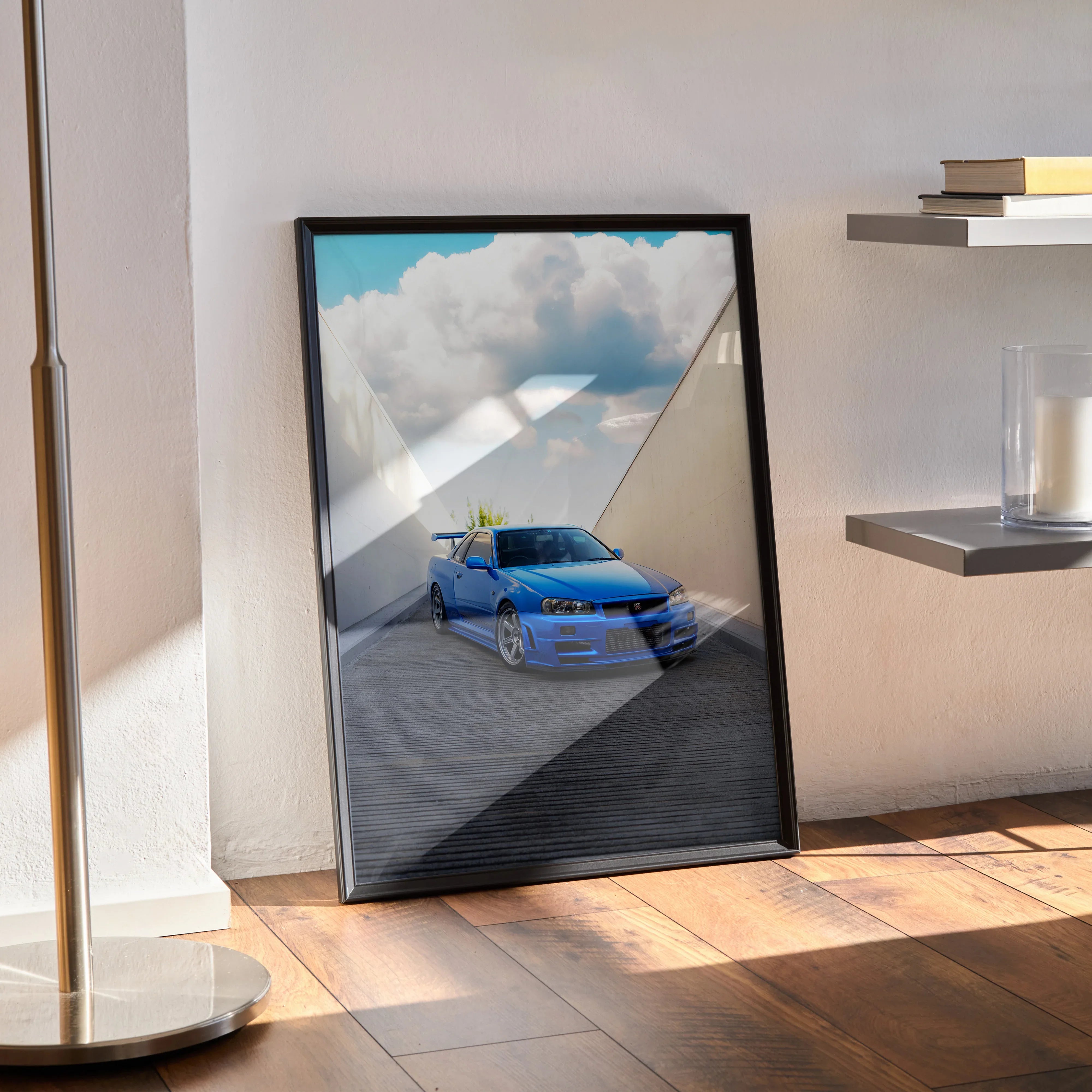 Nissan R34 GTR Skyline blue car poster framed wall art leaning against wall on wooden floor.