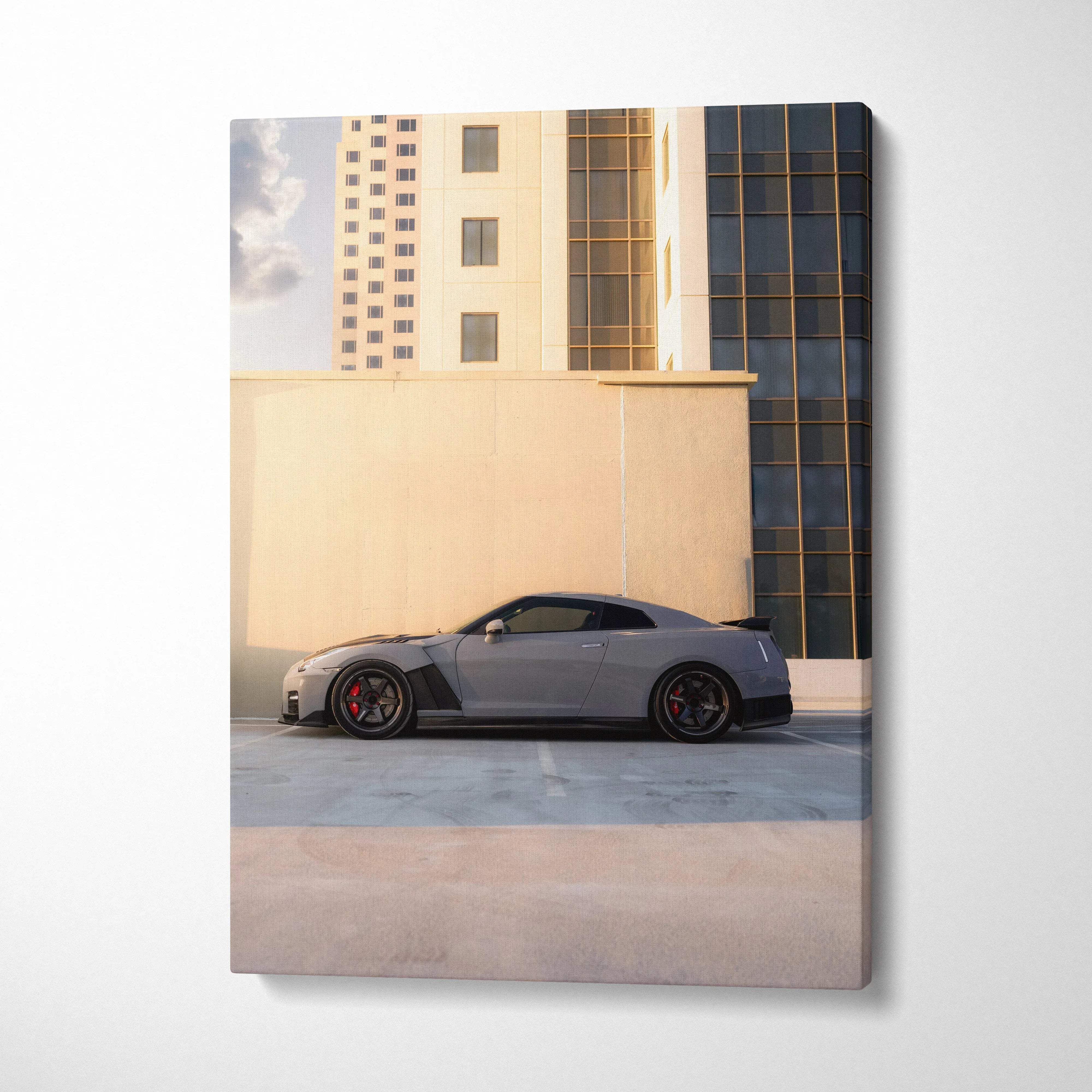Canvas wall art featuring a gray nissan r35 gtr sports car with black accents and red brake calipers in an urban cityscape
