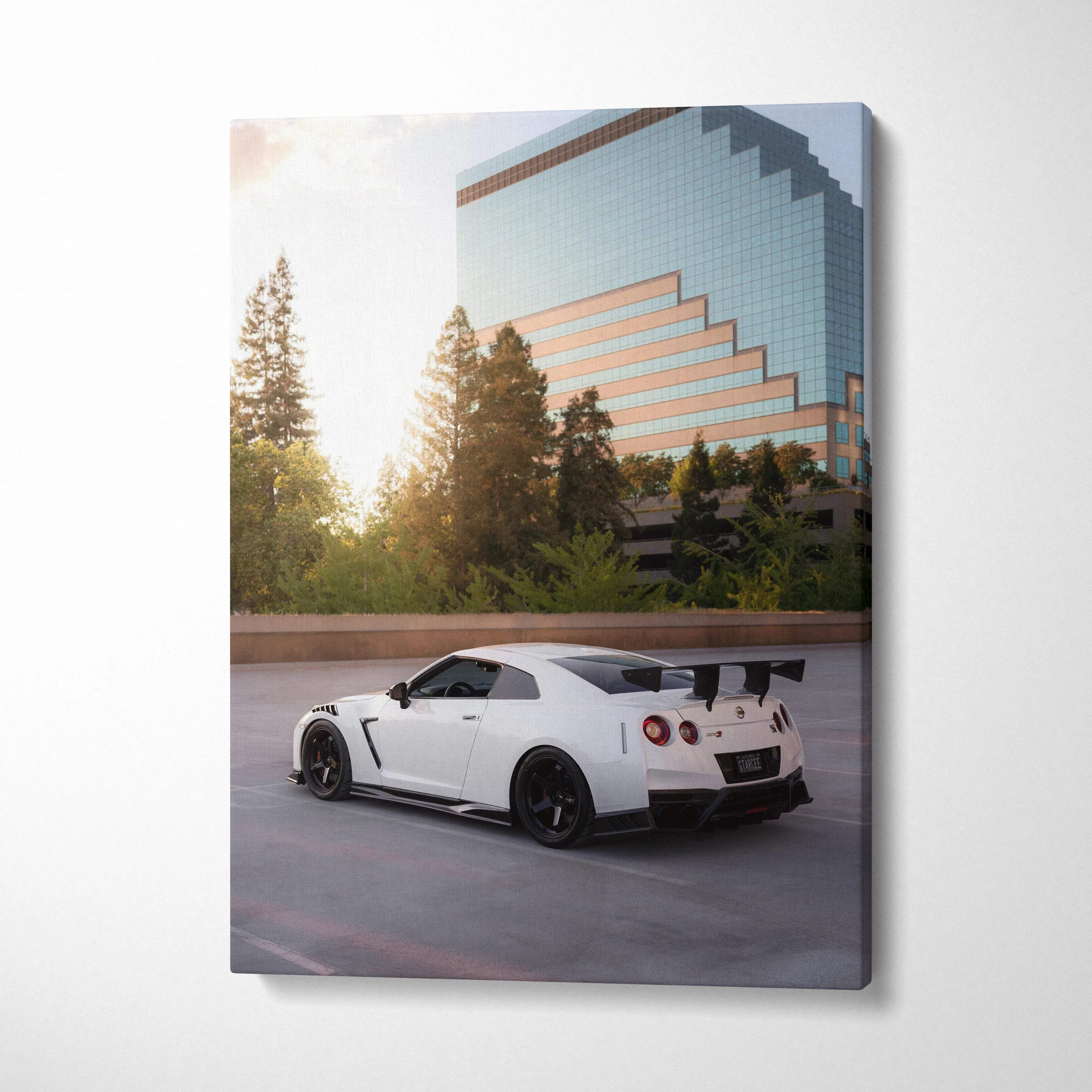 White Nissan GTR R35 parked with cityscape reflection on modern building vertical canvas wall art.