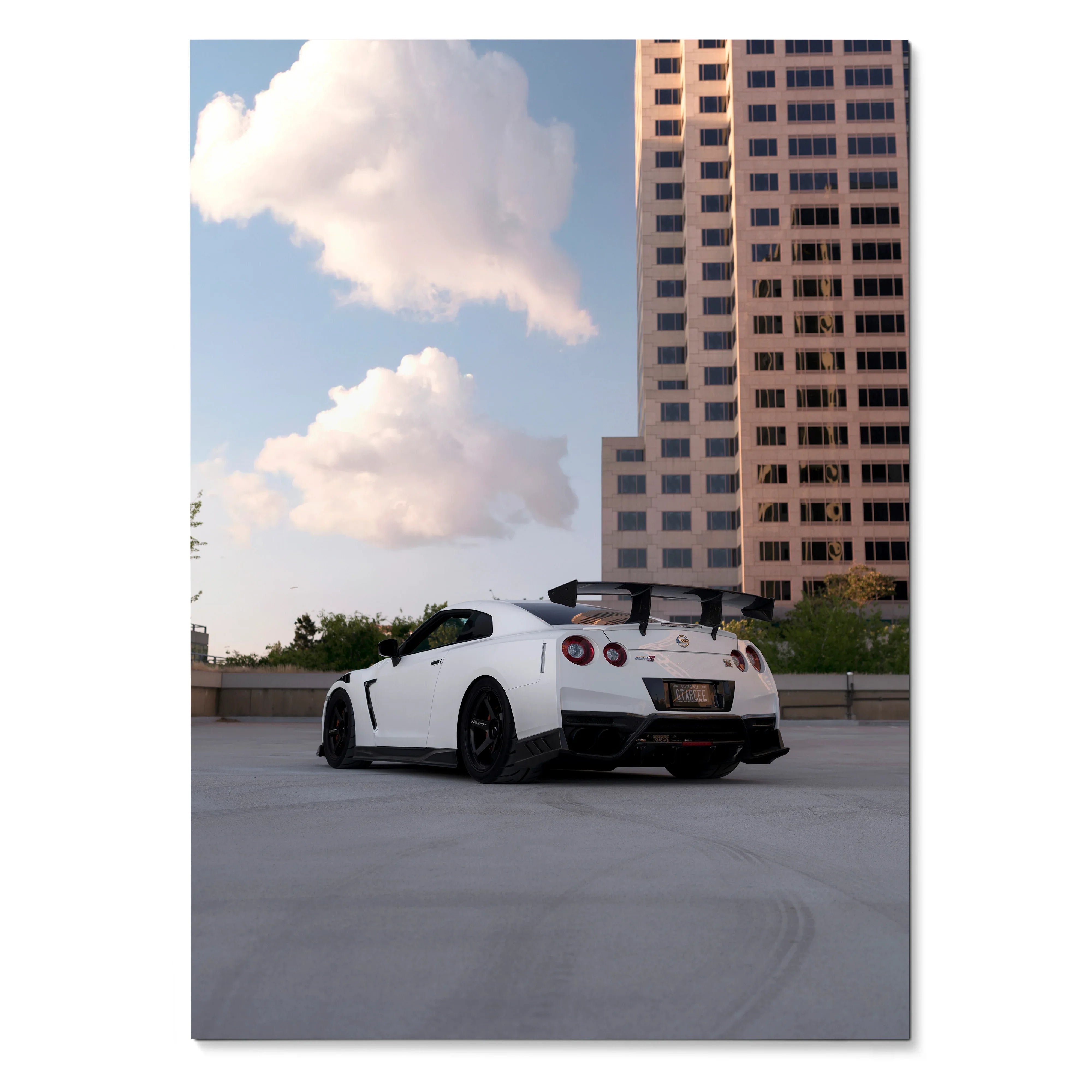 Nissan GTR R35 in white parked on rooftop with city building background poster wall art.