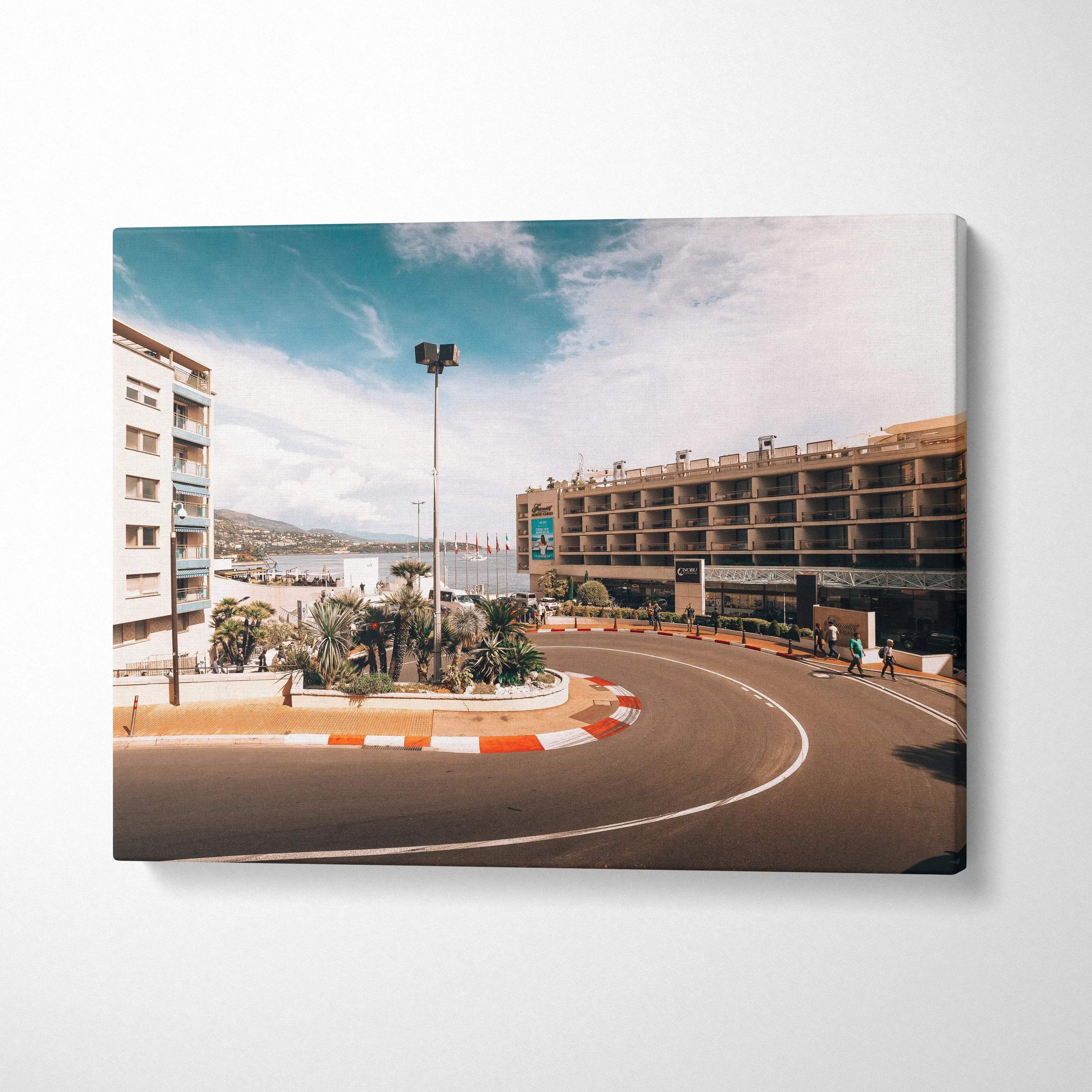 F1 track corner with surrounding buildings under blue sky on canvas wall art.