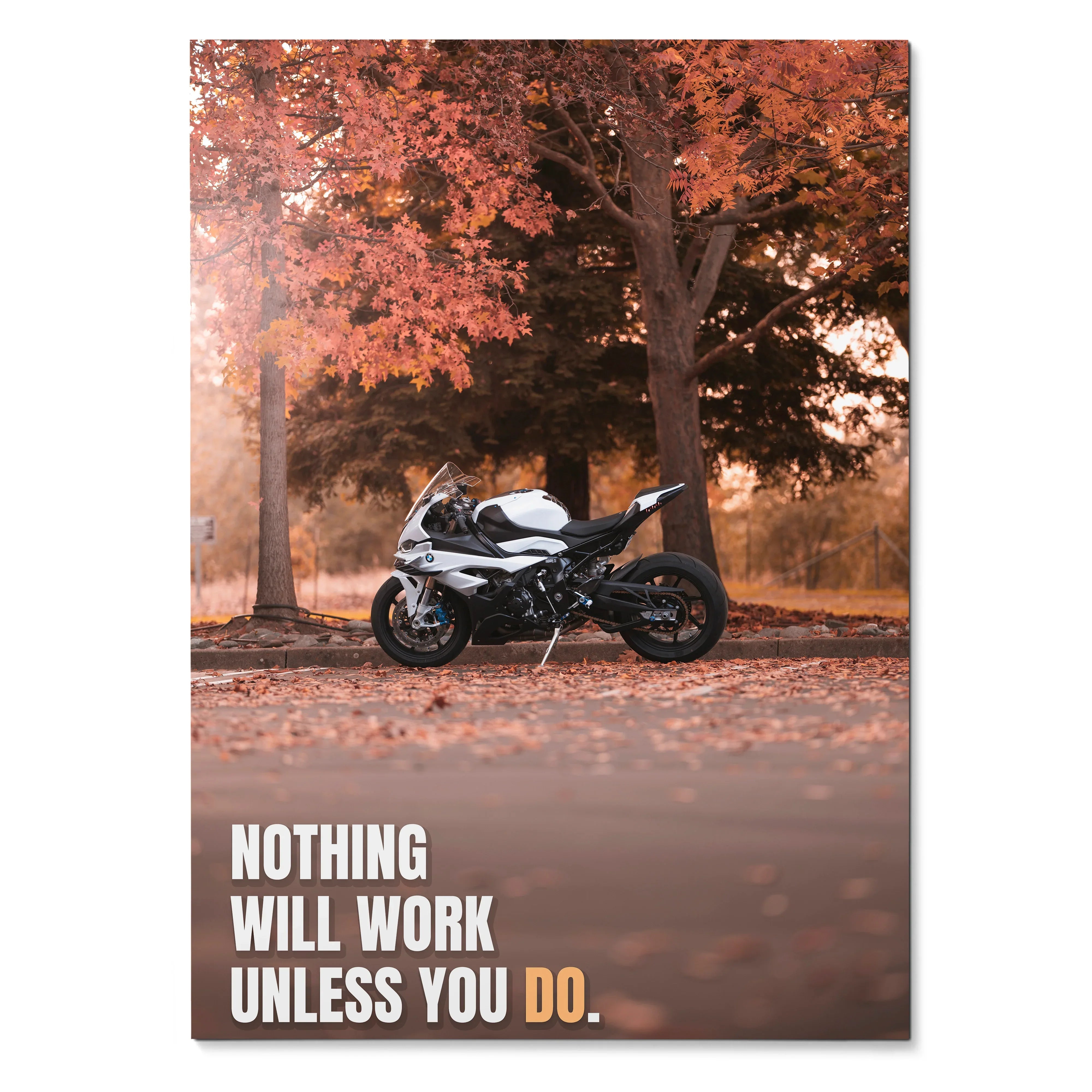 Motivational poster wall art with a black and white BMW S1000RR bike under autumn trees and inspiring text.