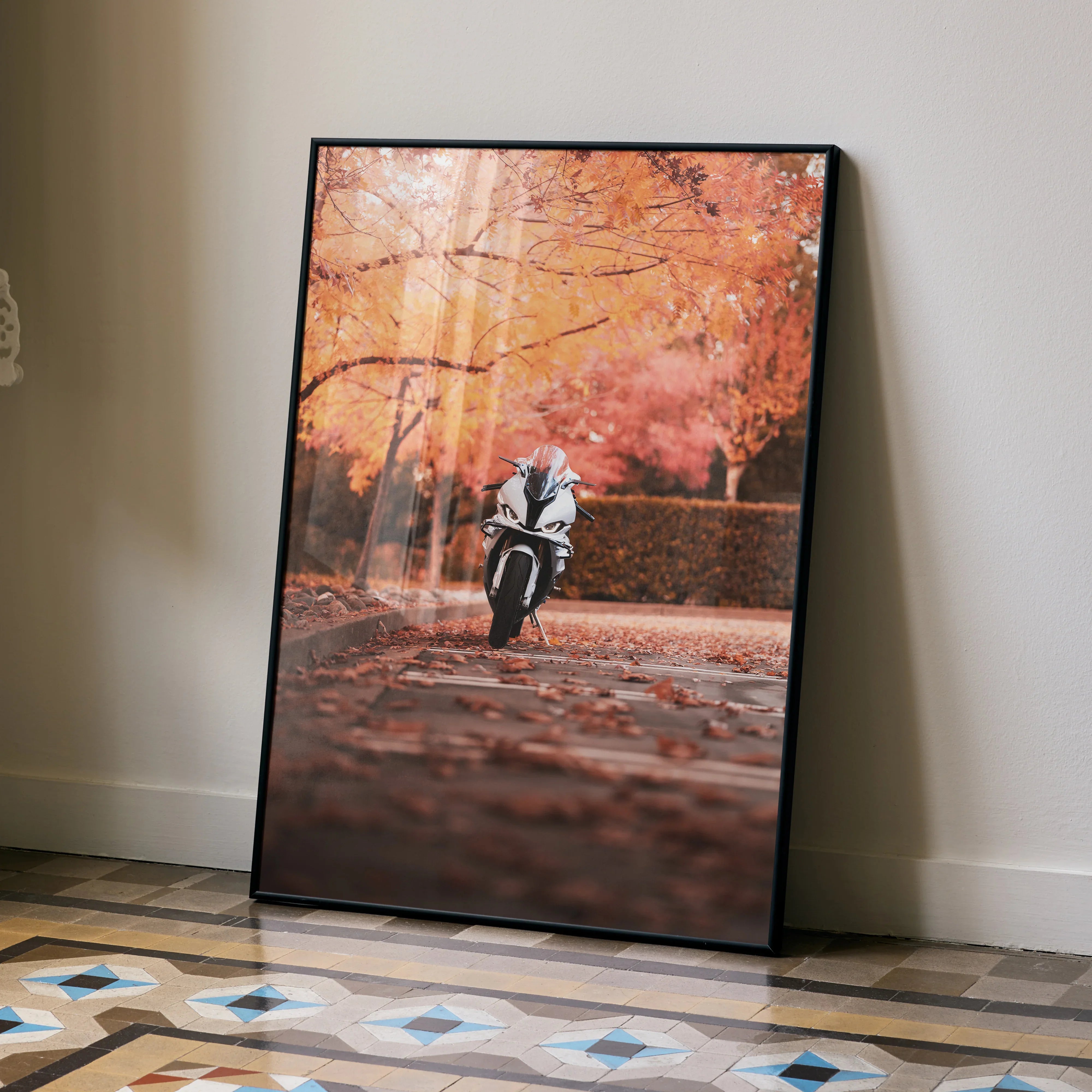 BMW S1000RR motorcycle speeding on autumn road poster wall art with orange foliage background.