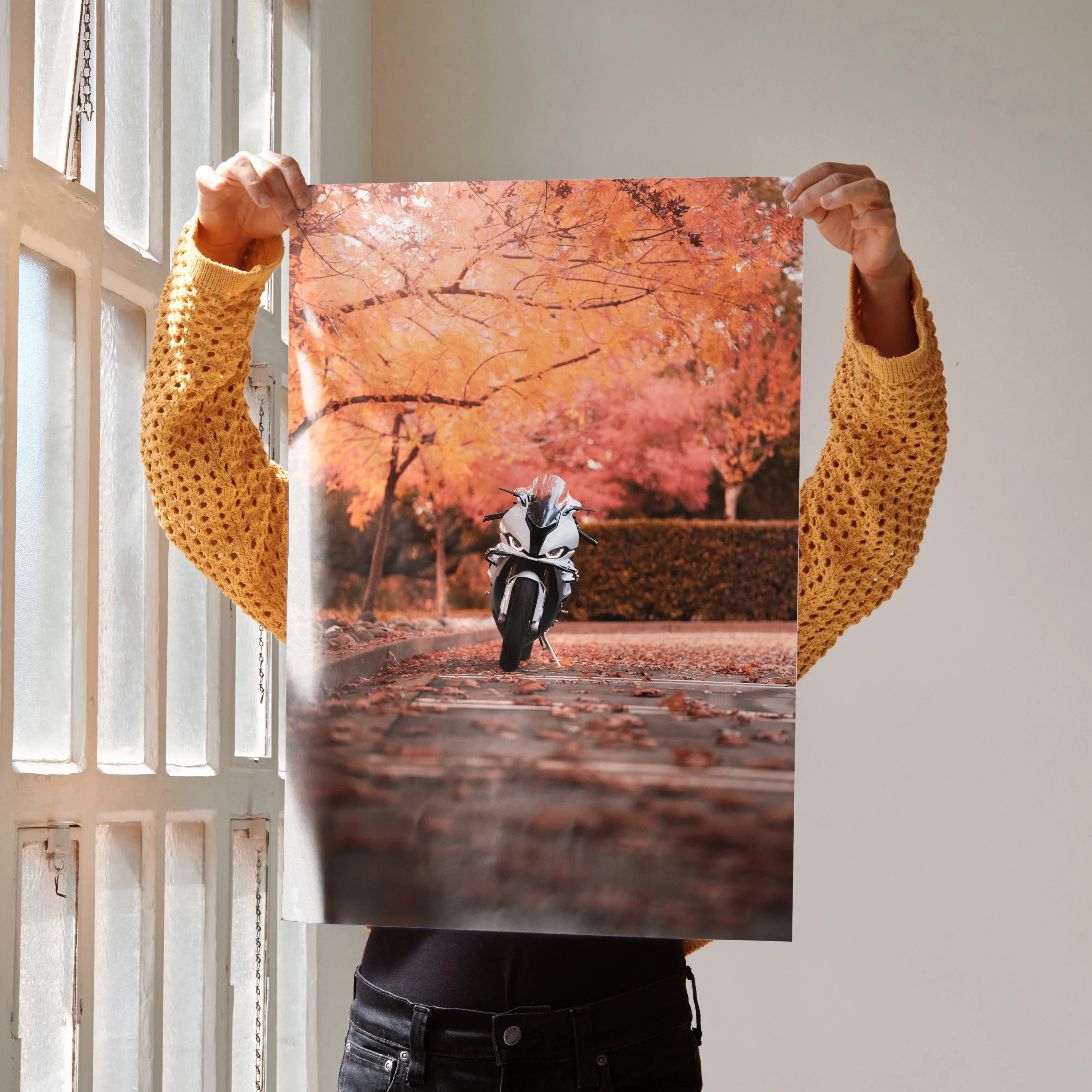 Poster wall art featuring a BMW S1000RR motorcycle on a road surrounded by autumn orange foliage.