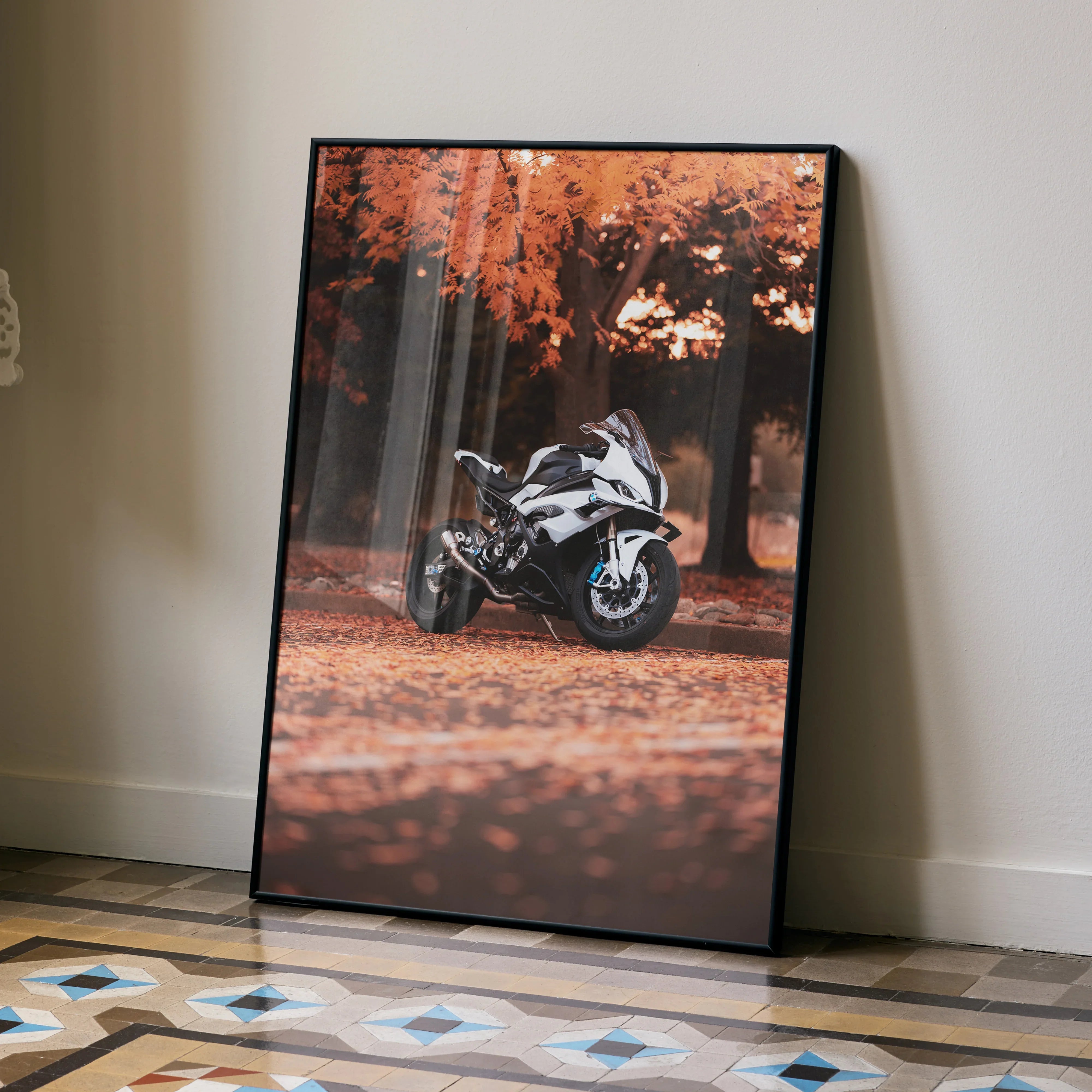 BMW S1000RR motorcycle poster with autumn forest background wall art in black frame.