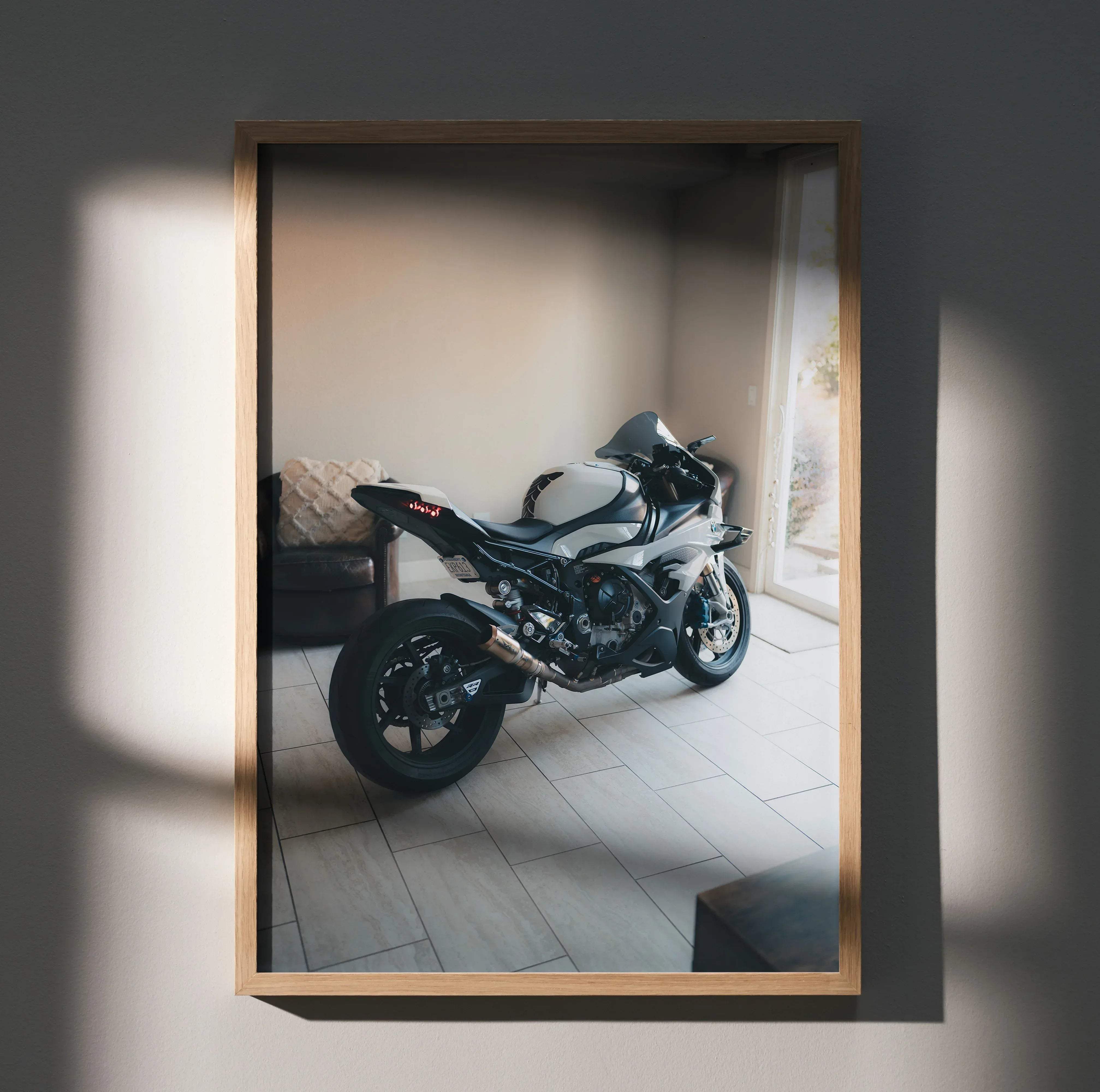 A framed high resolution BMW inspired S1000RR poster featuring a sleek white and black sport motorcycle with silver accents