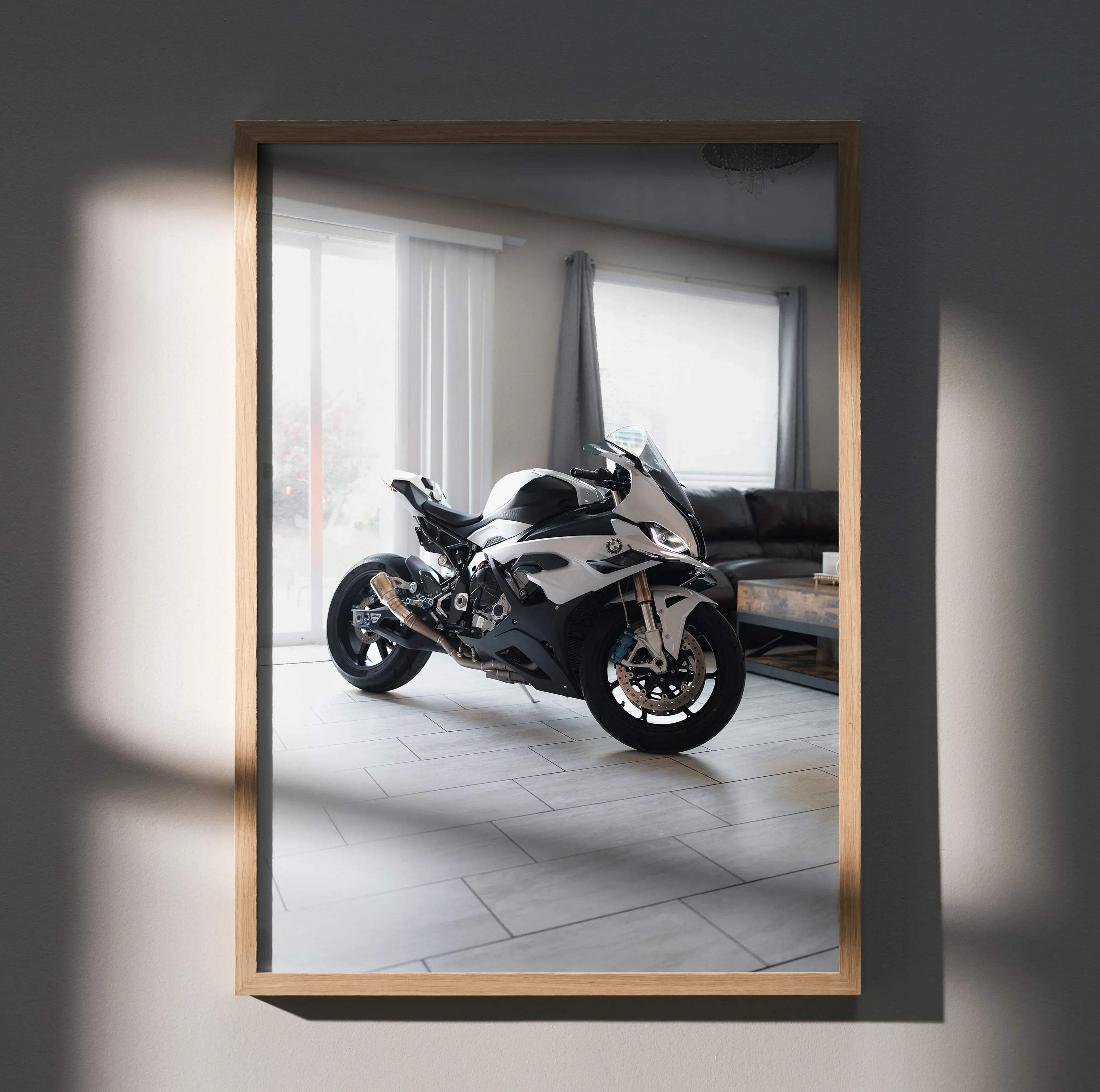 A framed high resolution poster of a sleek white and black BMW S1000RR motorcycle in an elegant wooden frame