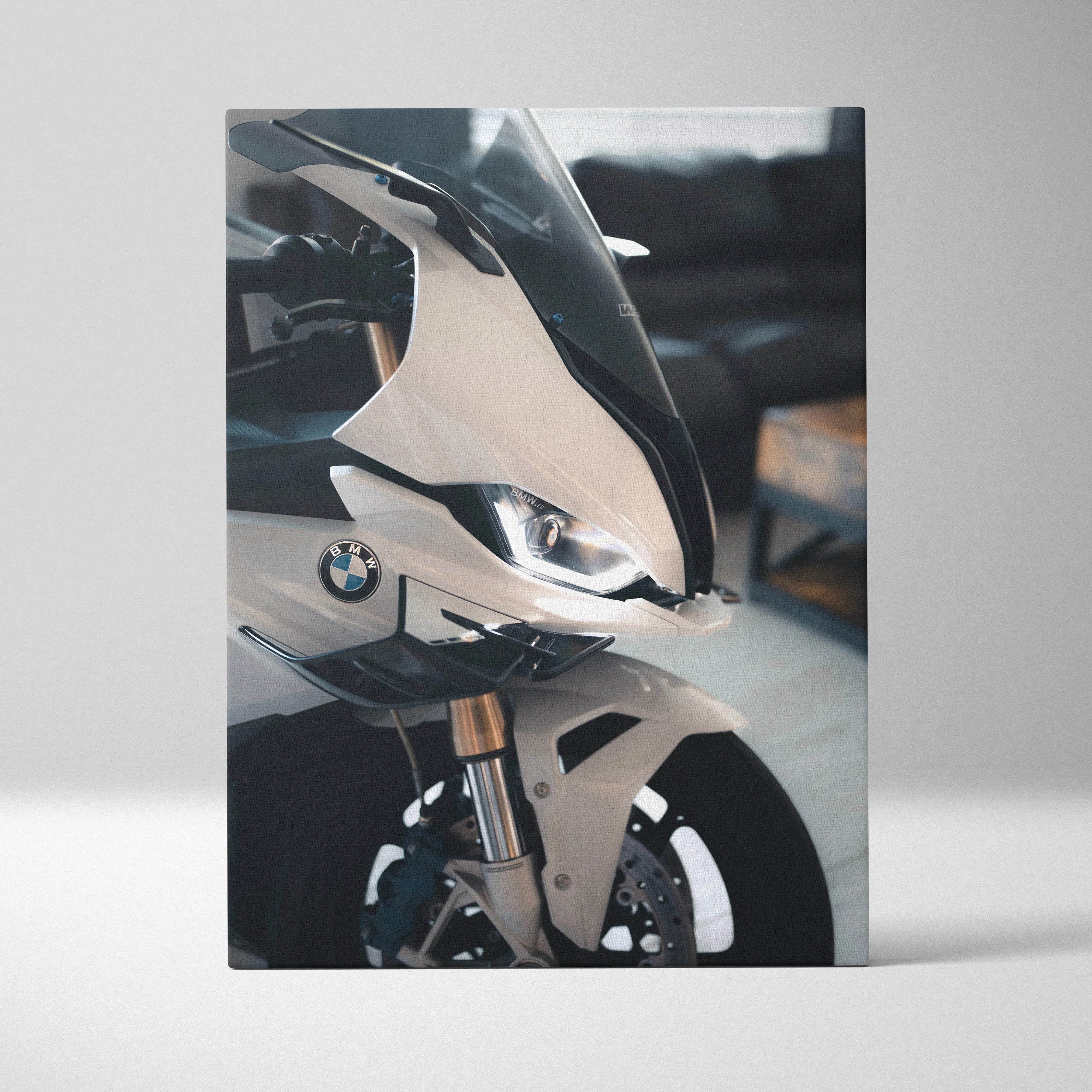 BMW S1000RR close-up vertical canvas art featuring sleek white motorcycle details and logo.