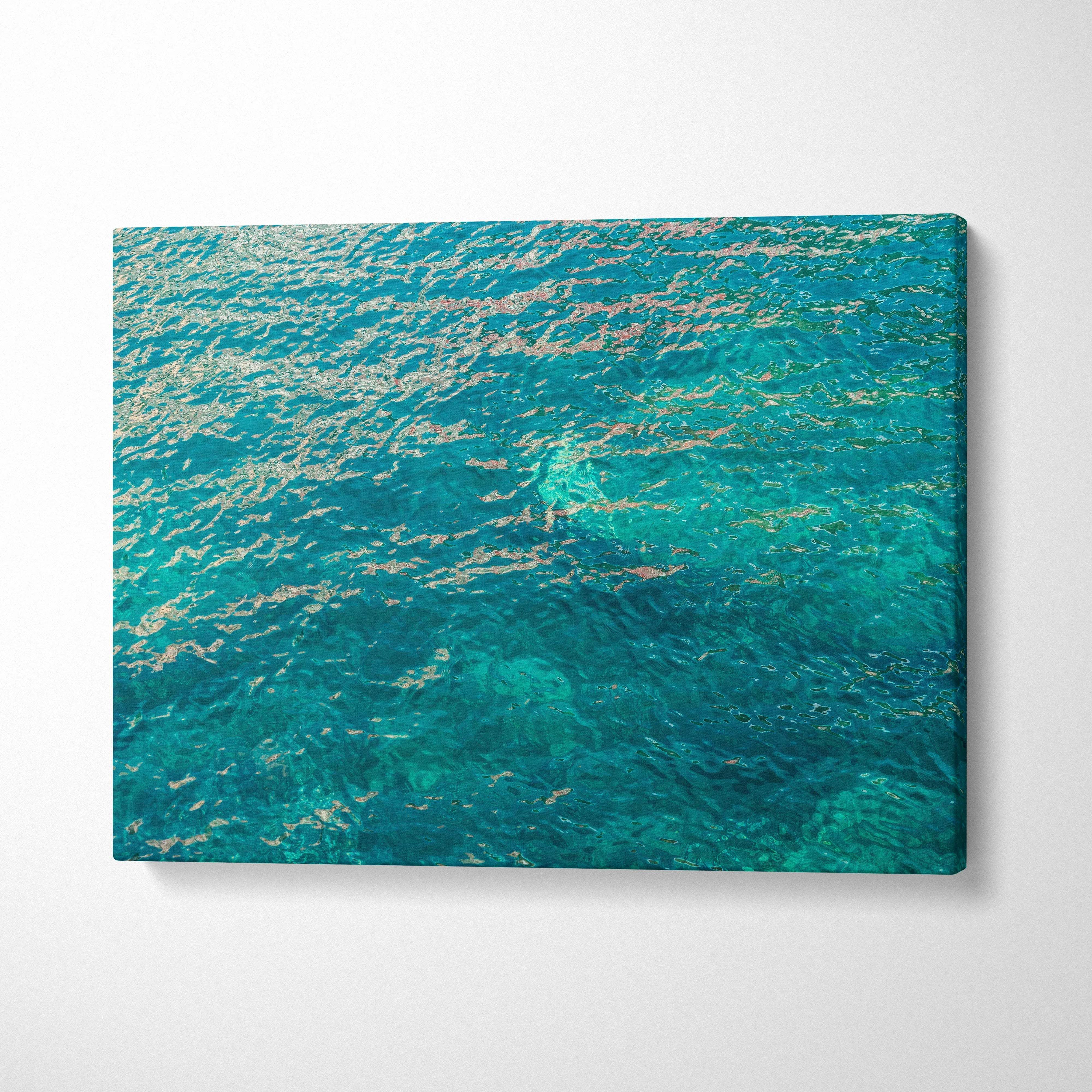 Vibrant turquoise ocean canvas print with shimmering gold reflections