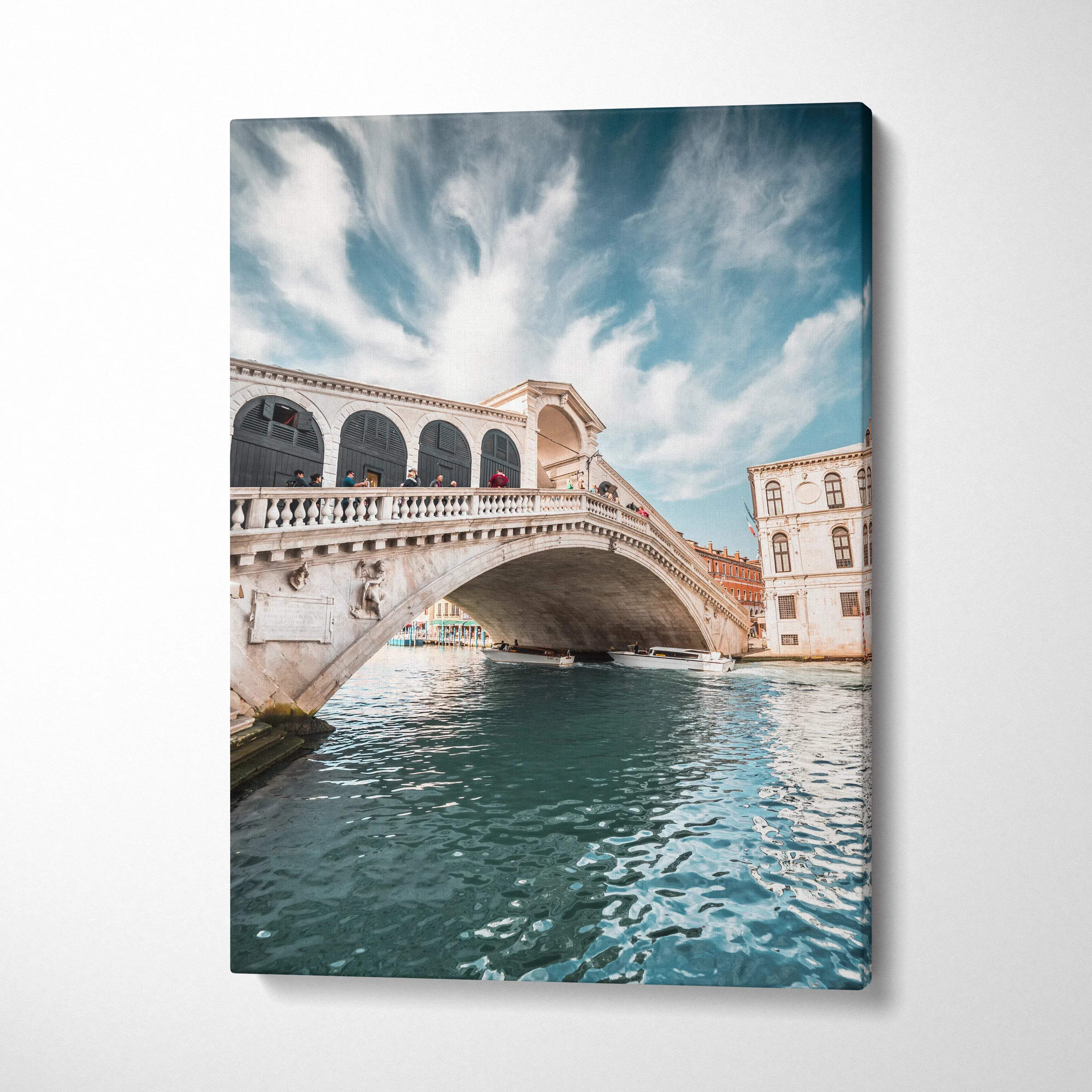 Canvas wall art featuring a stunning architectural bridge over water under a cloudy sky.