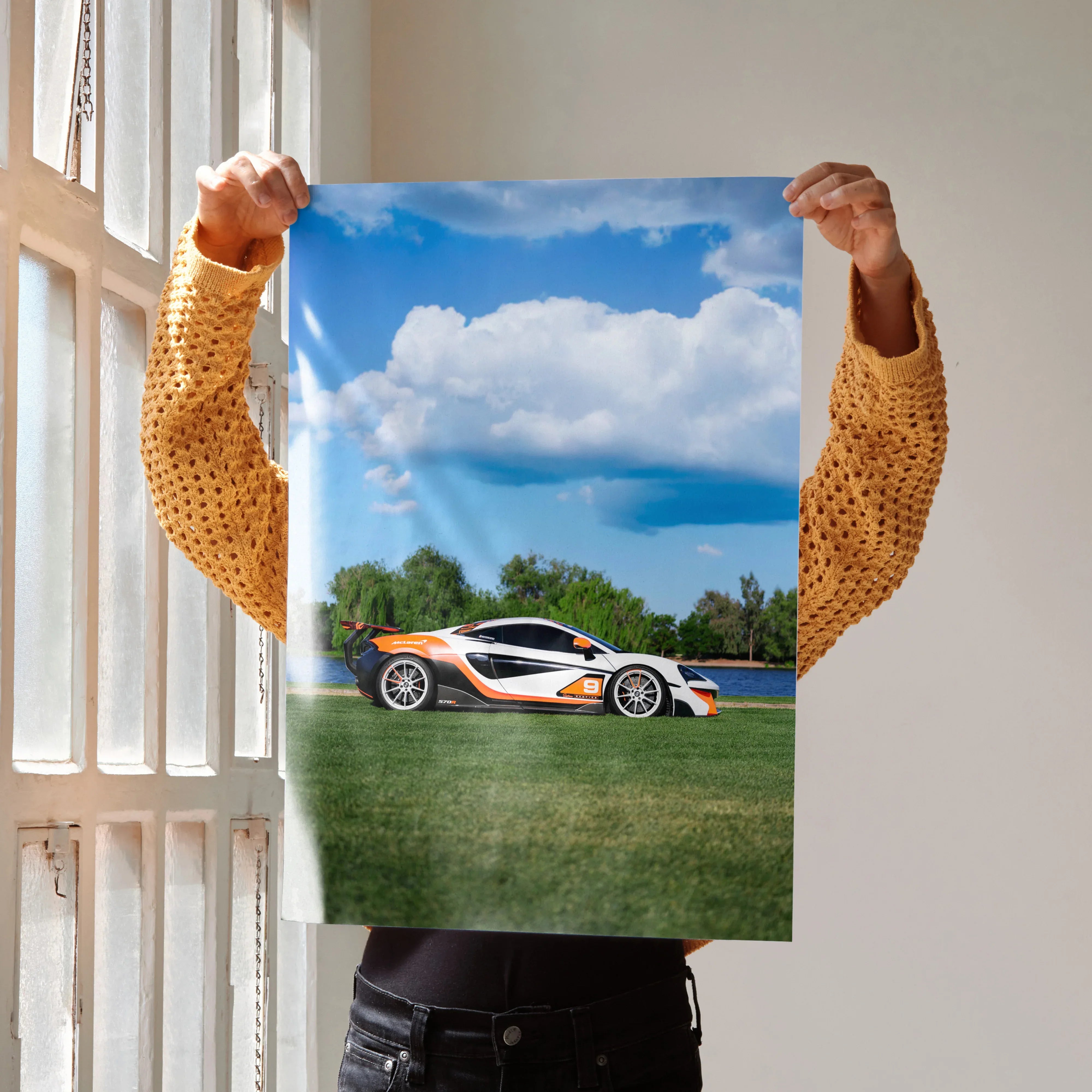 McLaren 570S sports car poster with blue sky and green grass wall art.