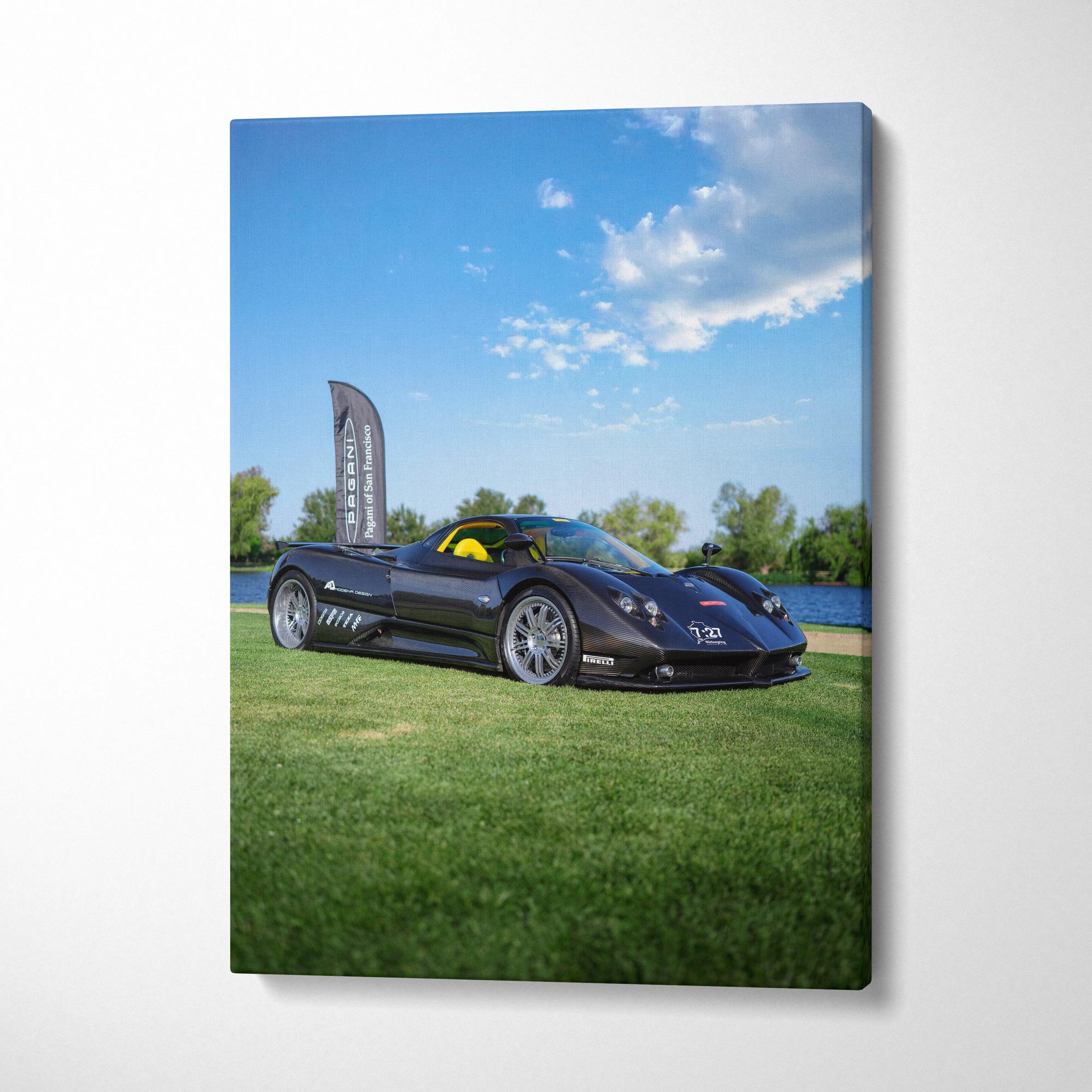 Pagani Zonda F Clubsport black sports car on grass under blue sky canvas wall art.