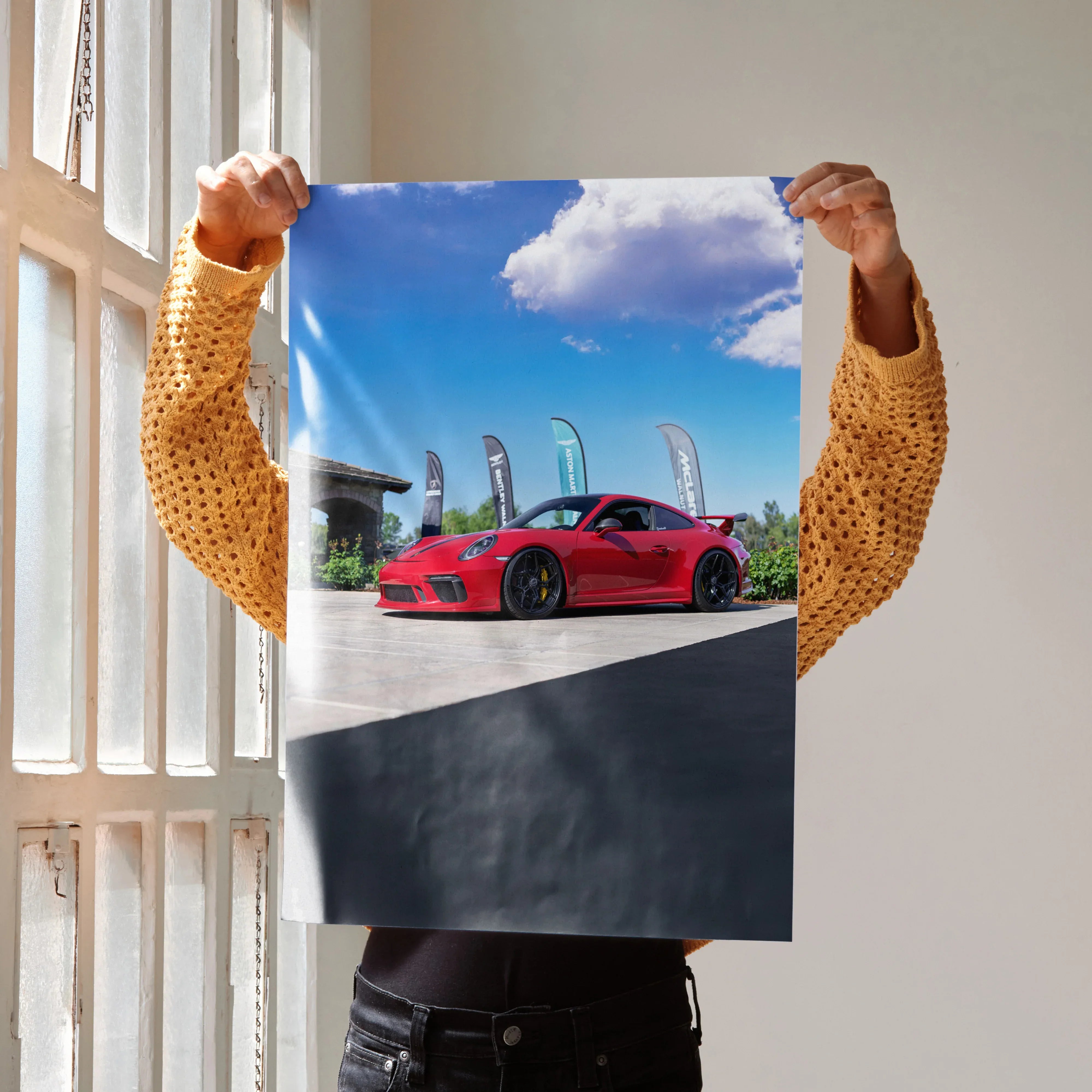 Red Porsche 911 GT3 sports car on racetrack under blue sky poster wall art.