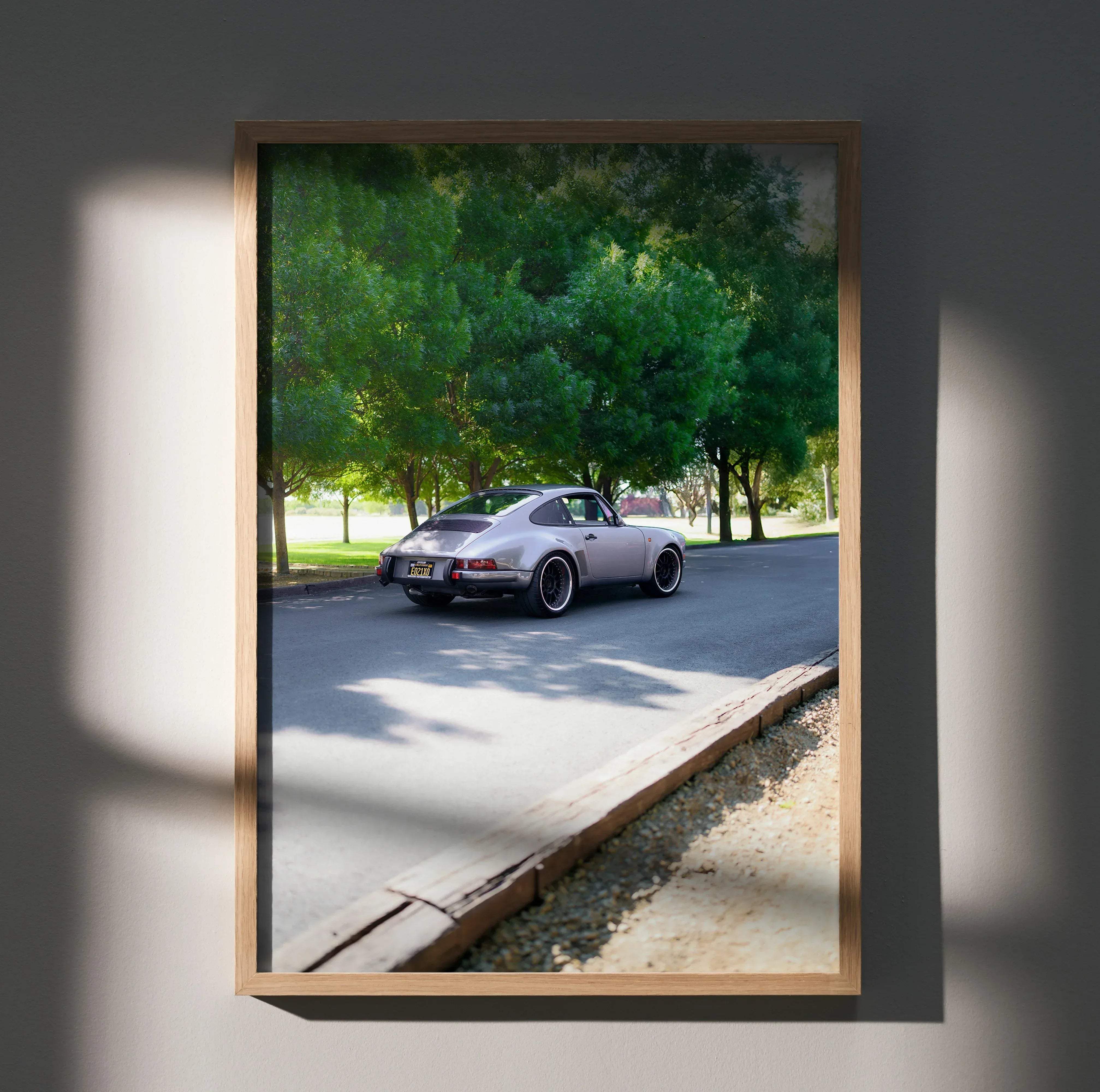Silver Porsche 911 sports car with black rims in a framed high resolution classic car poster #002