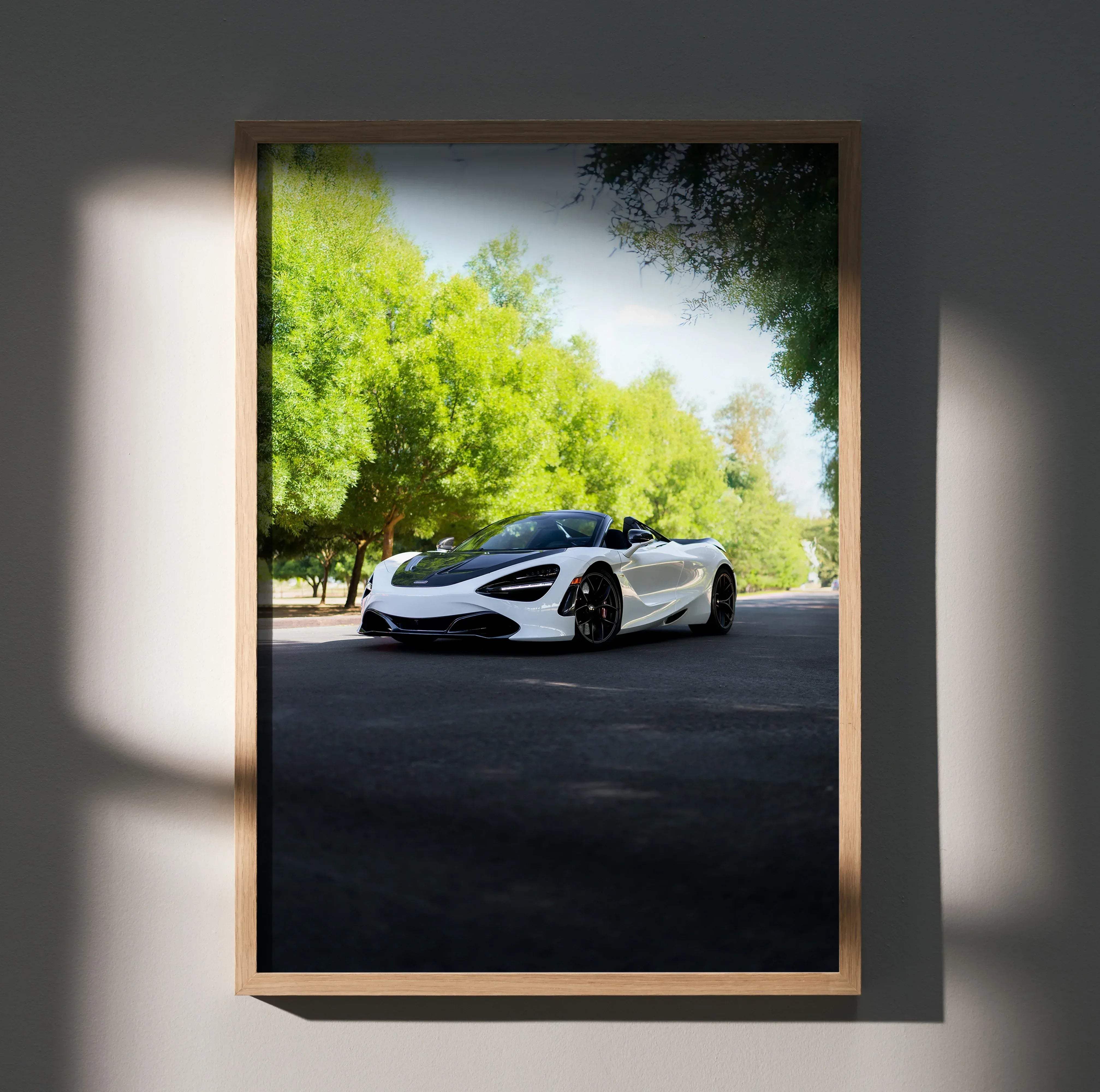 White and black mclaren 720s convertible sports car poster in light wood frame for wall decoration