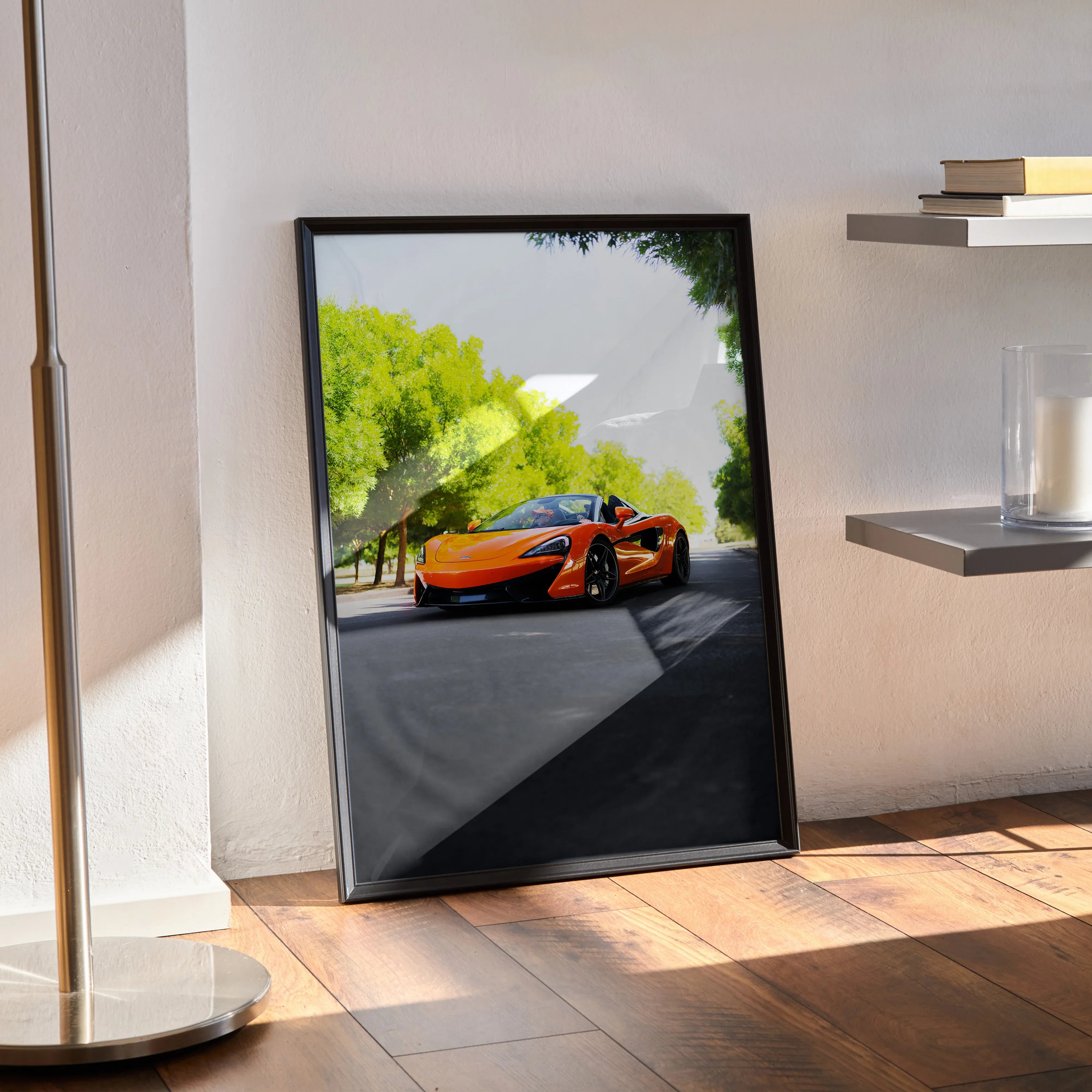 McLaren 570S orange sports car poster leaning on wall with sunlight shadows, sleek car wall art.