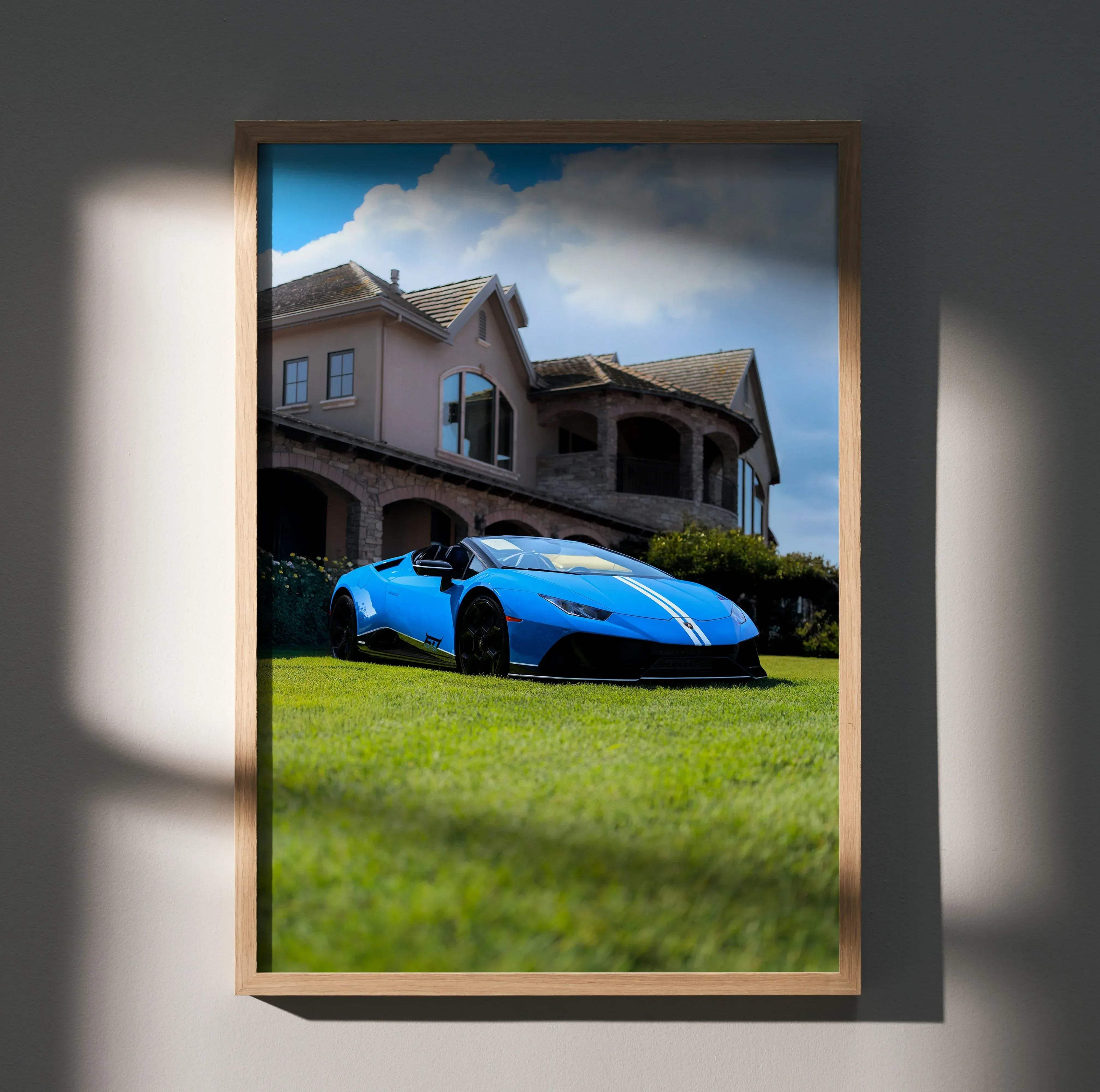 Lamborghini Huracan high resolution car poster featuring a blue Huracan with white racing stripes framed in light wood