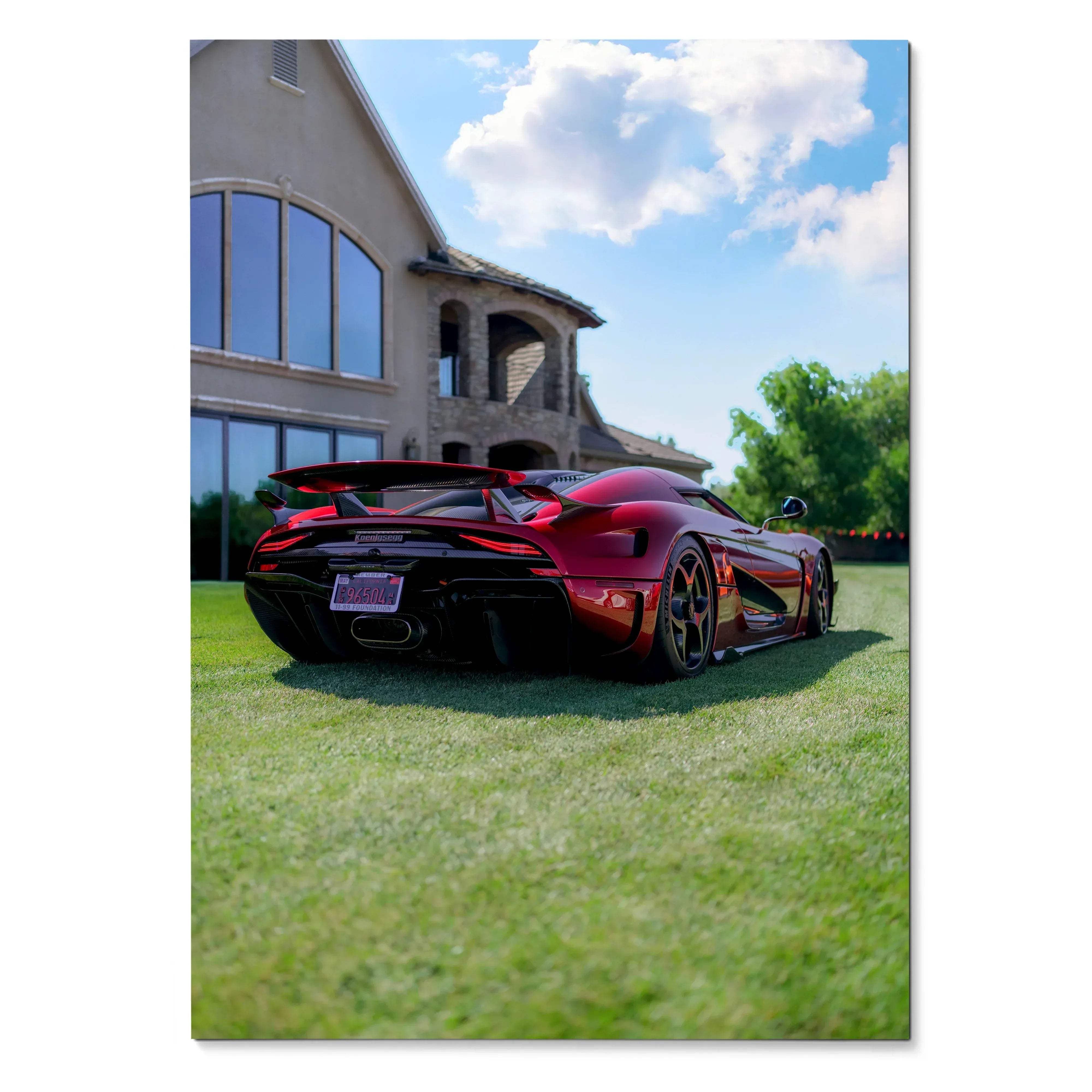 Koenigsegg Regera in metallic red parked on grass in front of modern house wall art poster.