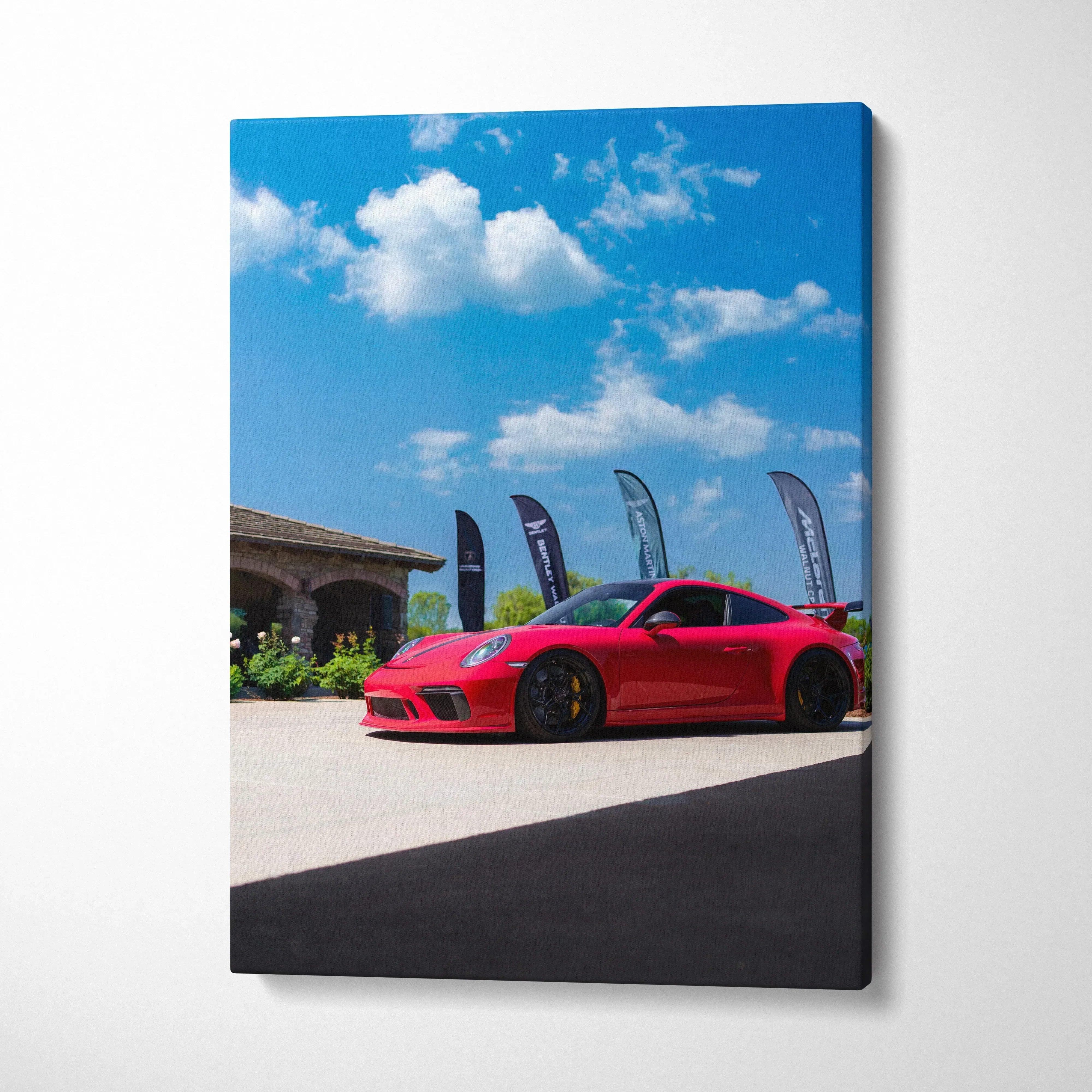 Red Porsche 911 GT3 parked outside under blue sky canvas wall art print.