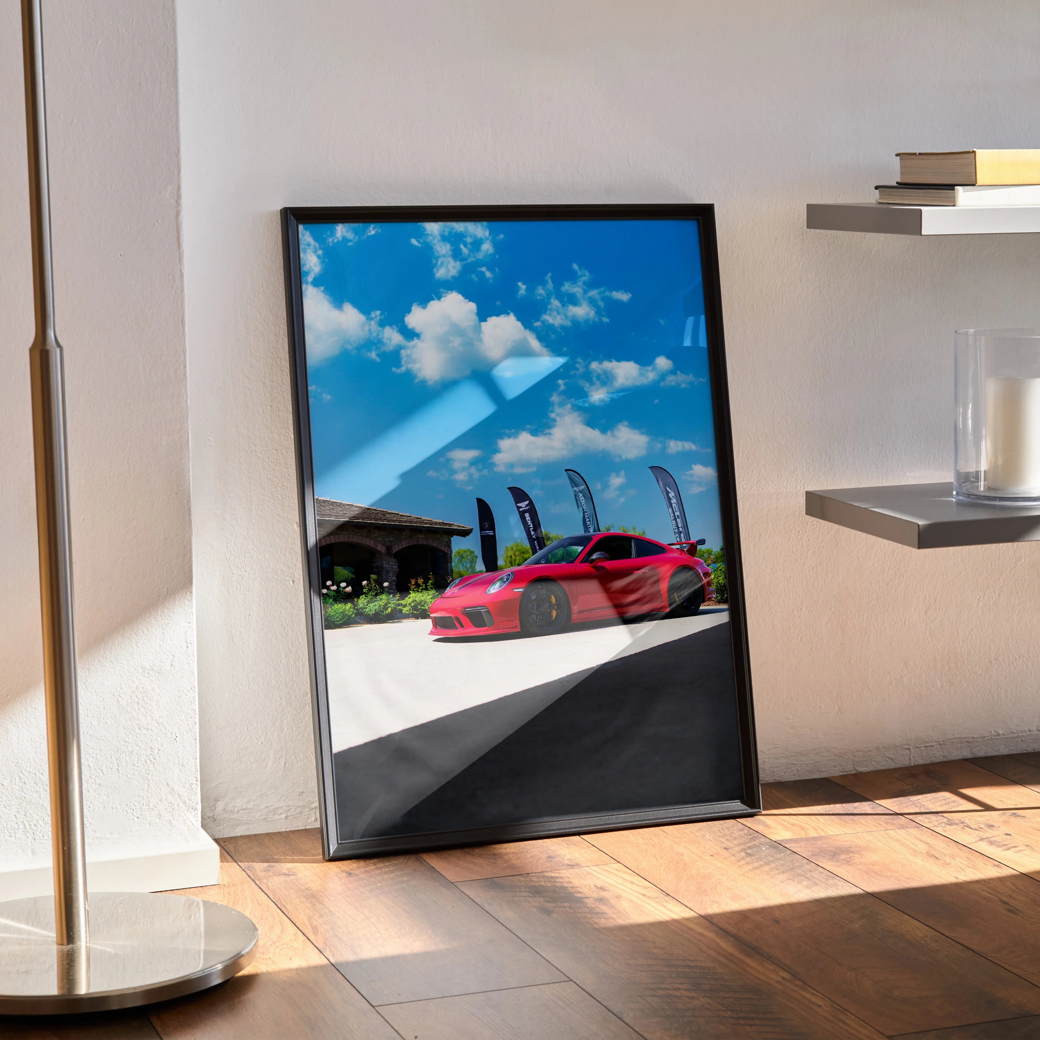 Porsche 911 GT3 red sports car poster with blue sky wall art in black frame.