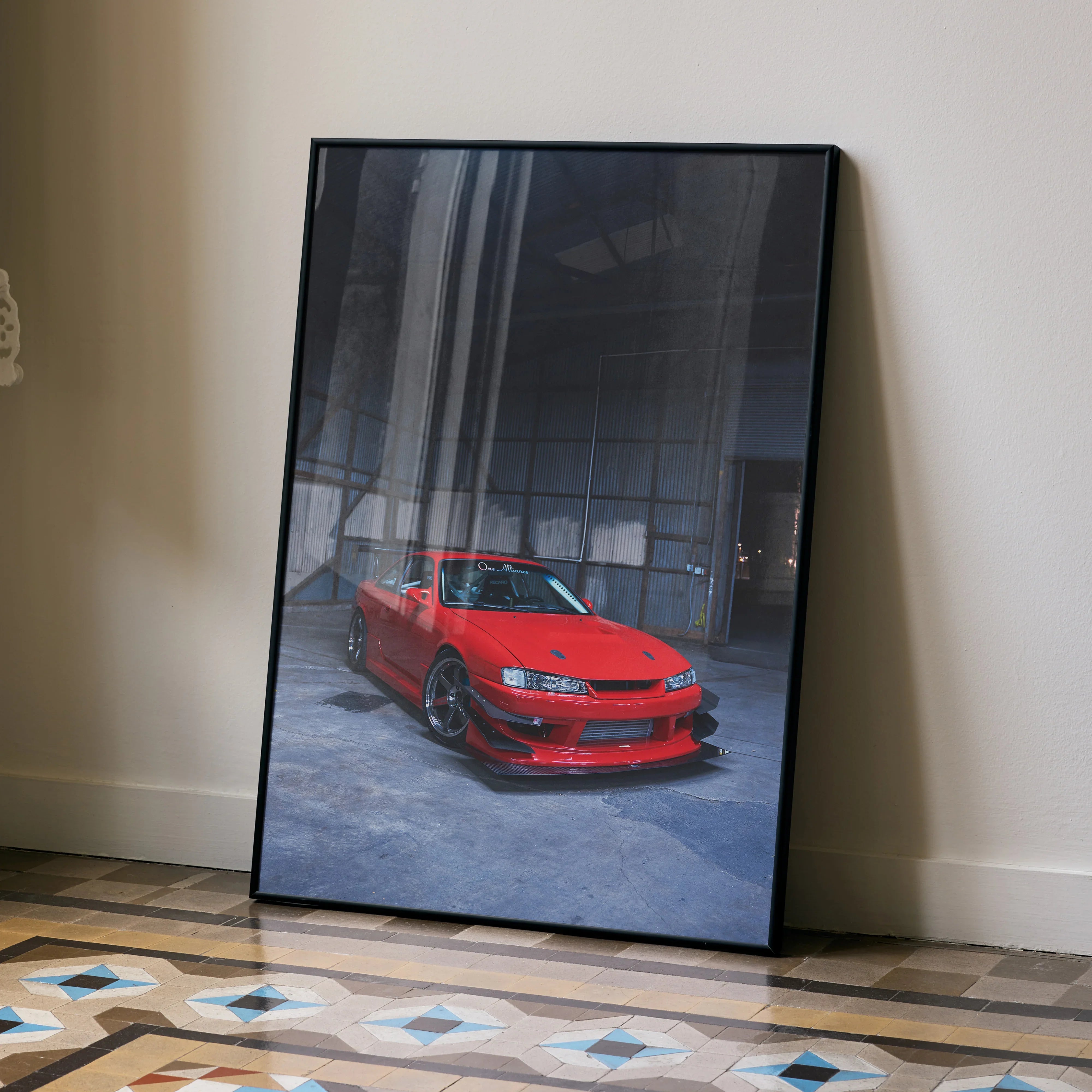 Red Nissan 240sx S14 Kouki car poster leaning on wall, automotive wall art.