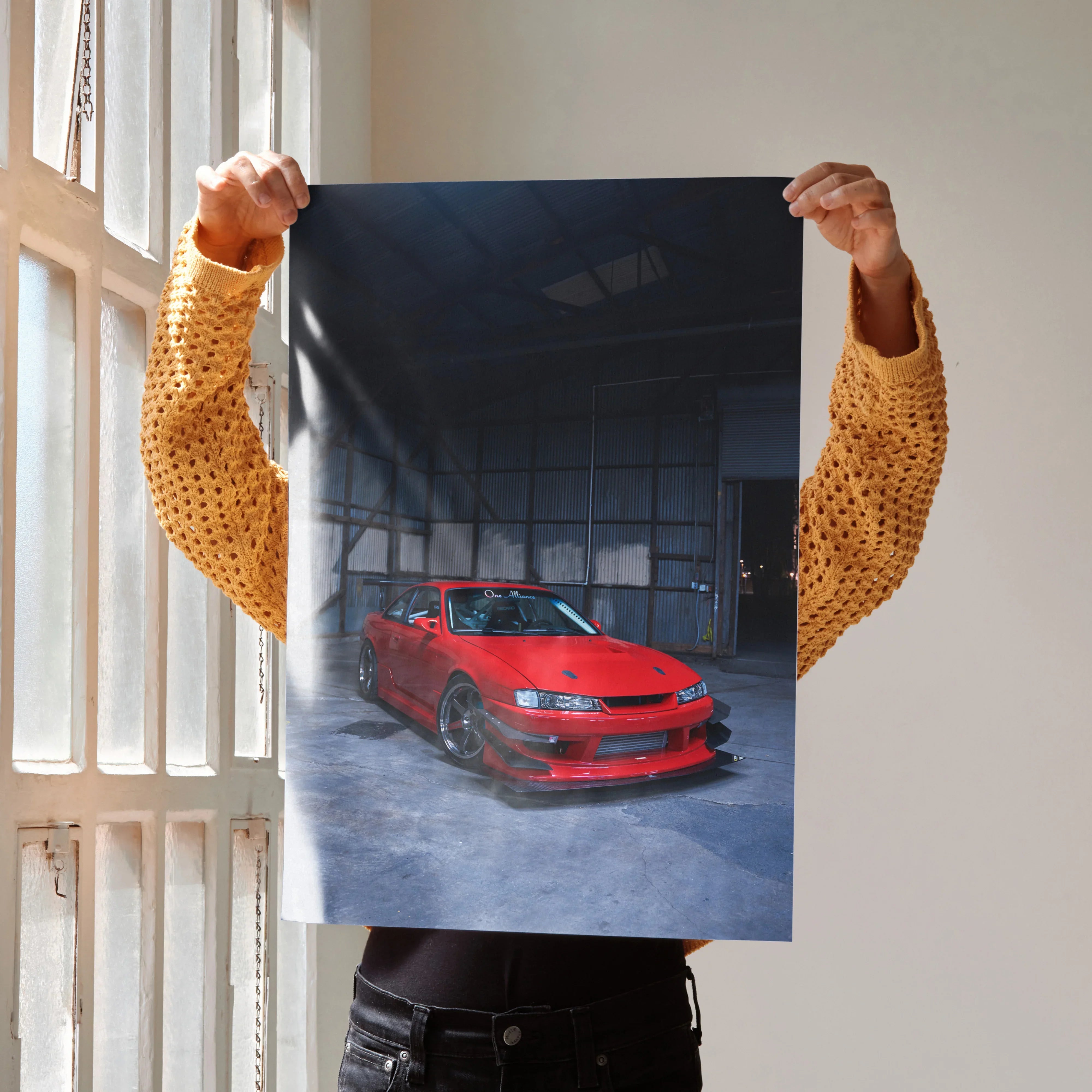 Poster wall art featuring a red Nissan 240sx S14 Kouki in a dark industrial setting.