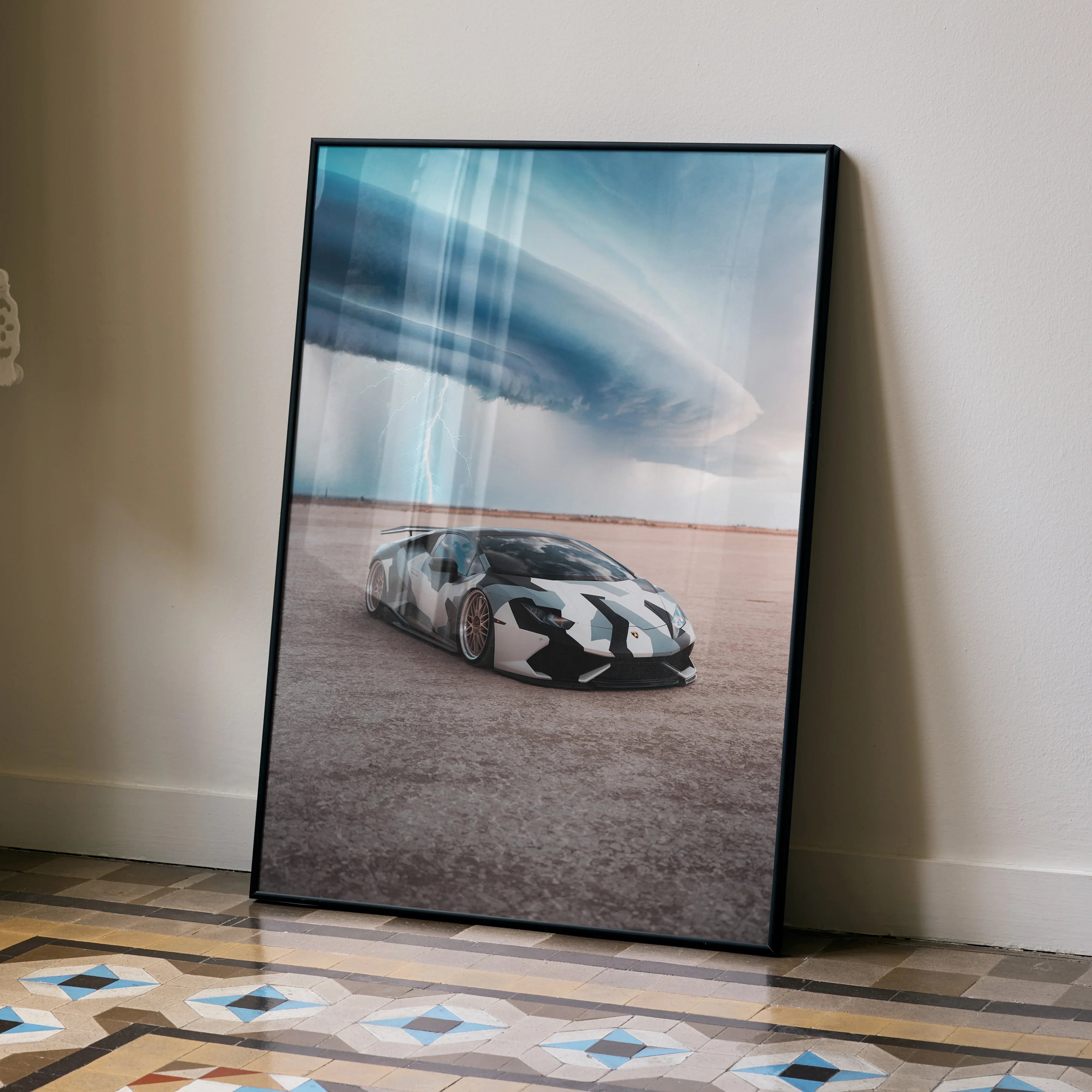 Lamborghini Huracan poster with dramatic stormy sky, desert background wall art in black frame.