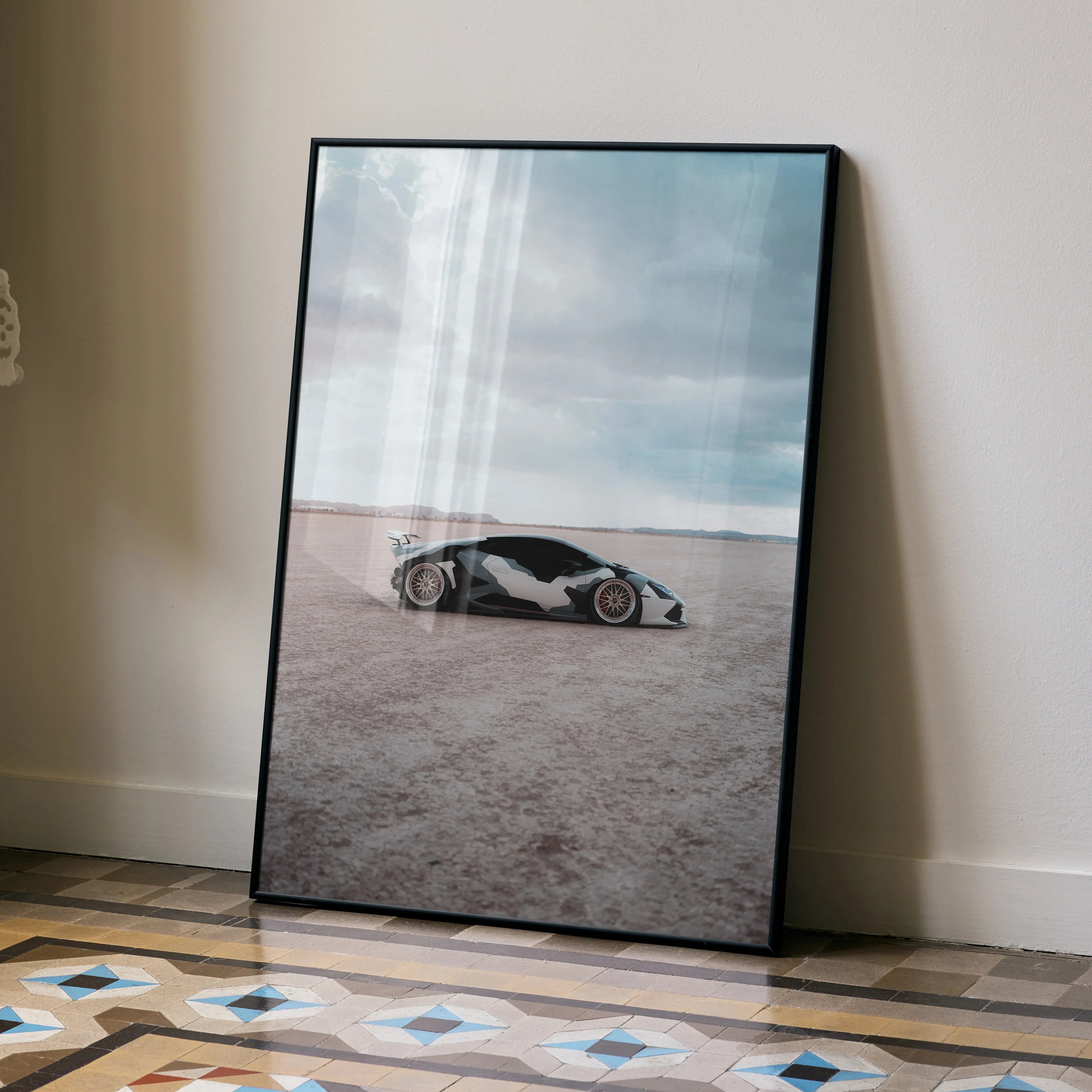 Lamborghini Huracan poster featuring sleek white sports car on a desert landscape wall art.