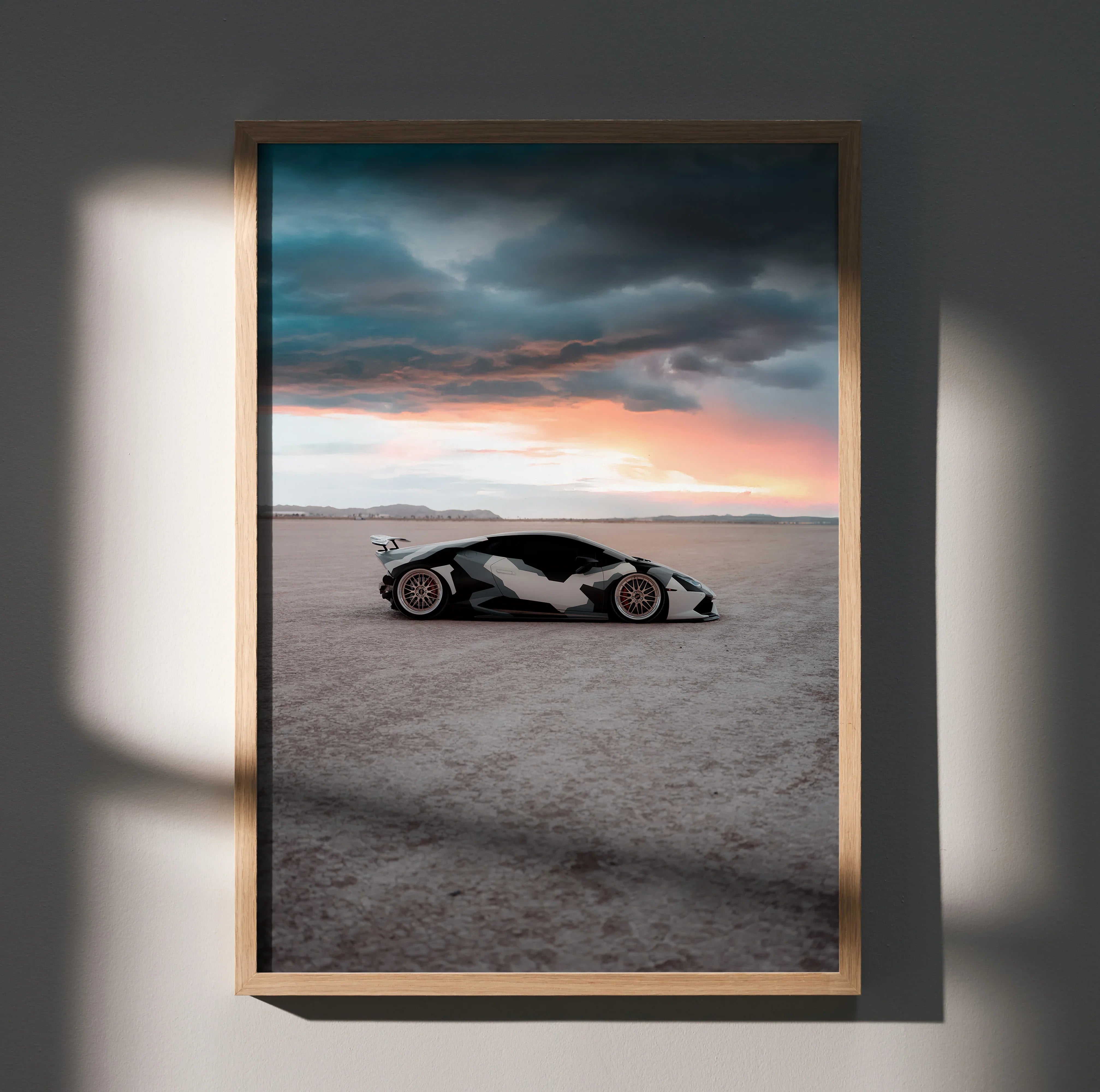 Lamborghini Huracan poster wall art with dramatic sunset and stormy clouds in desert setting.