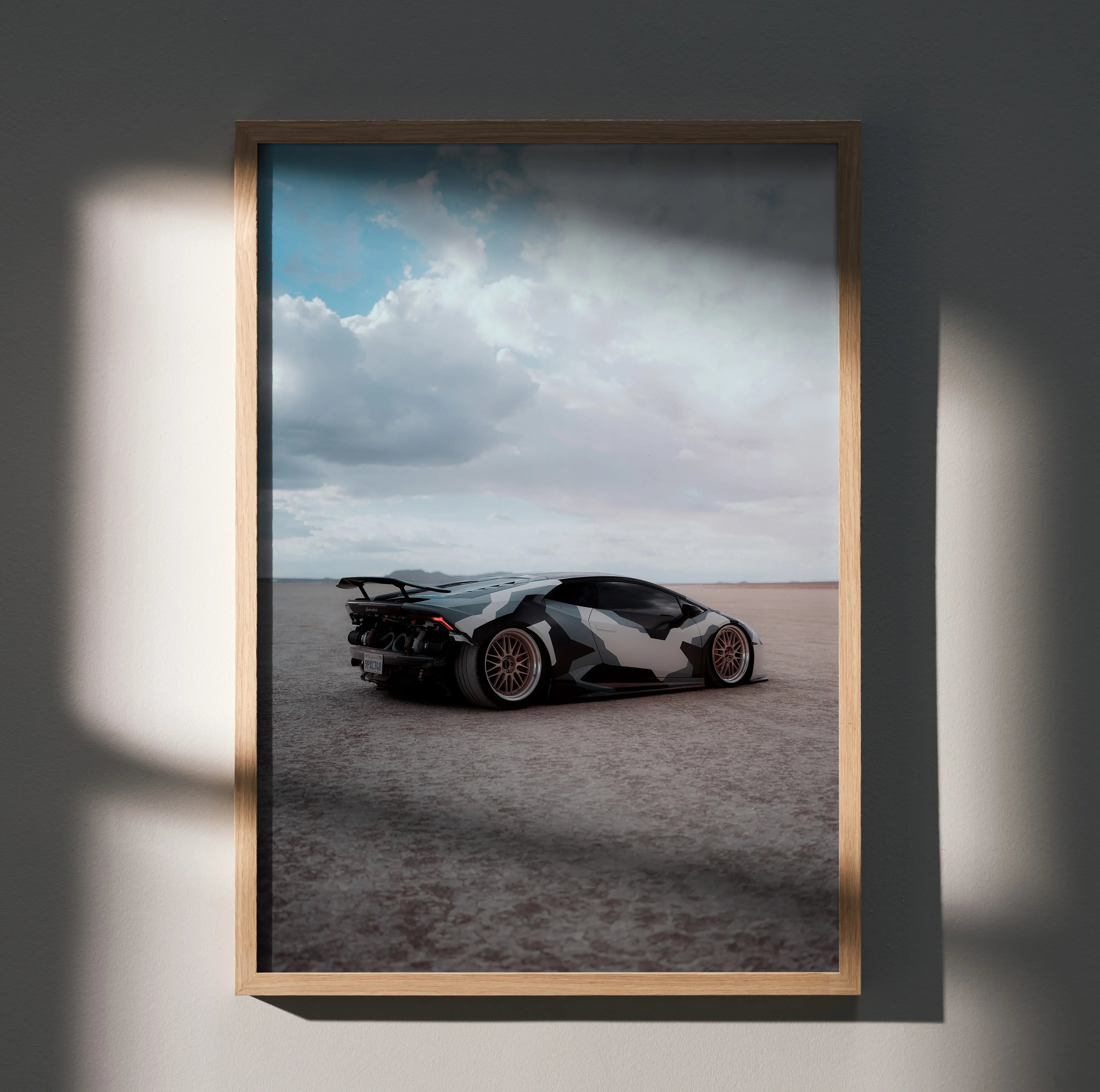 Lamborghini Huracan poster showing sleek white sports car on desert landscape wall art.