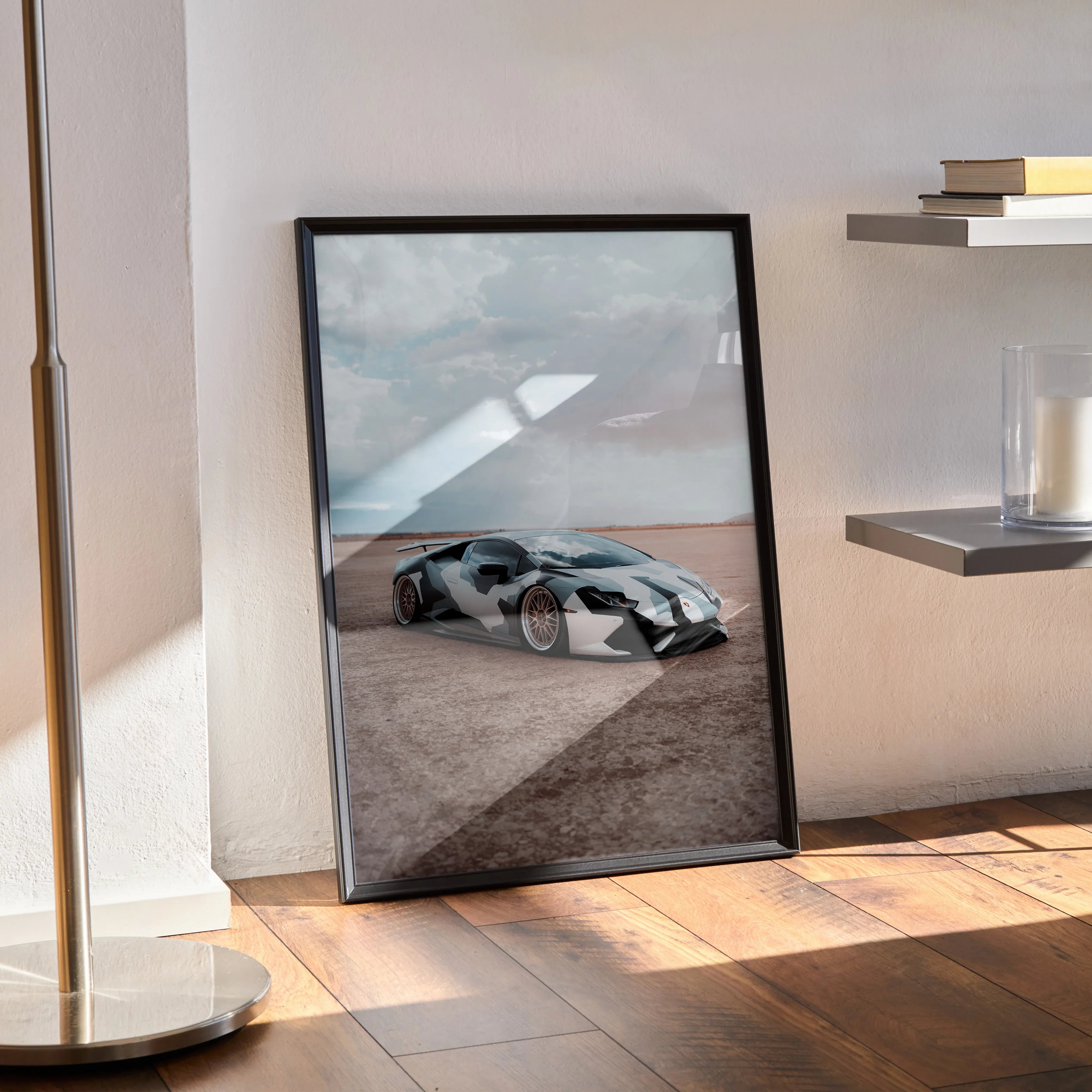 Lamborghini Huracan poster wall art showing sleek gray sports car on desert road with cloudy sky background.