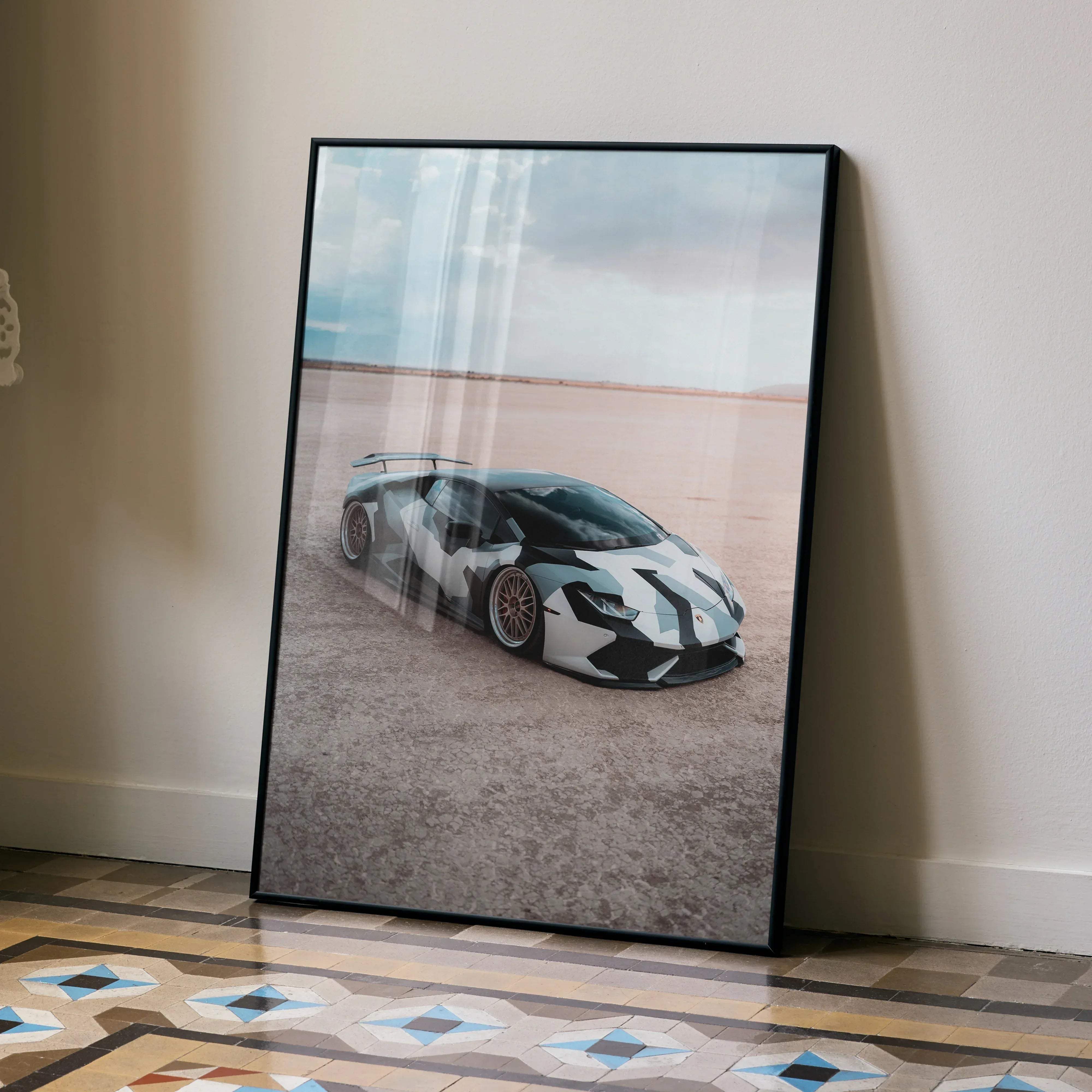 Black-framed poster featuring a white and black camouflage patterned Lamborghini Huracan sports car high resolution image