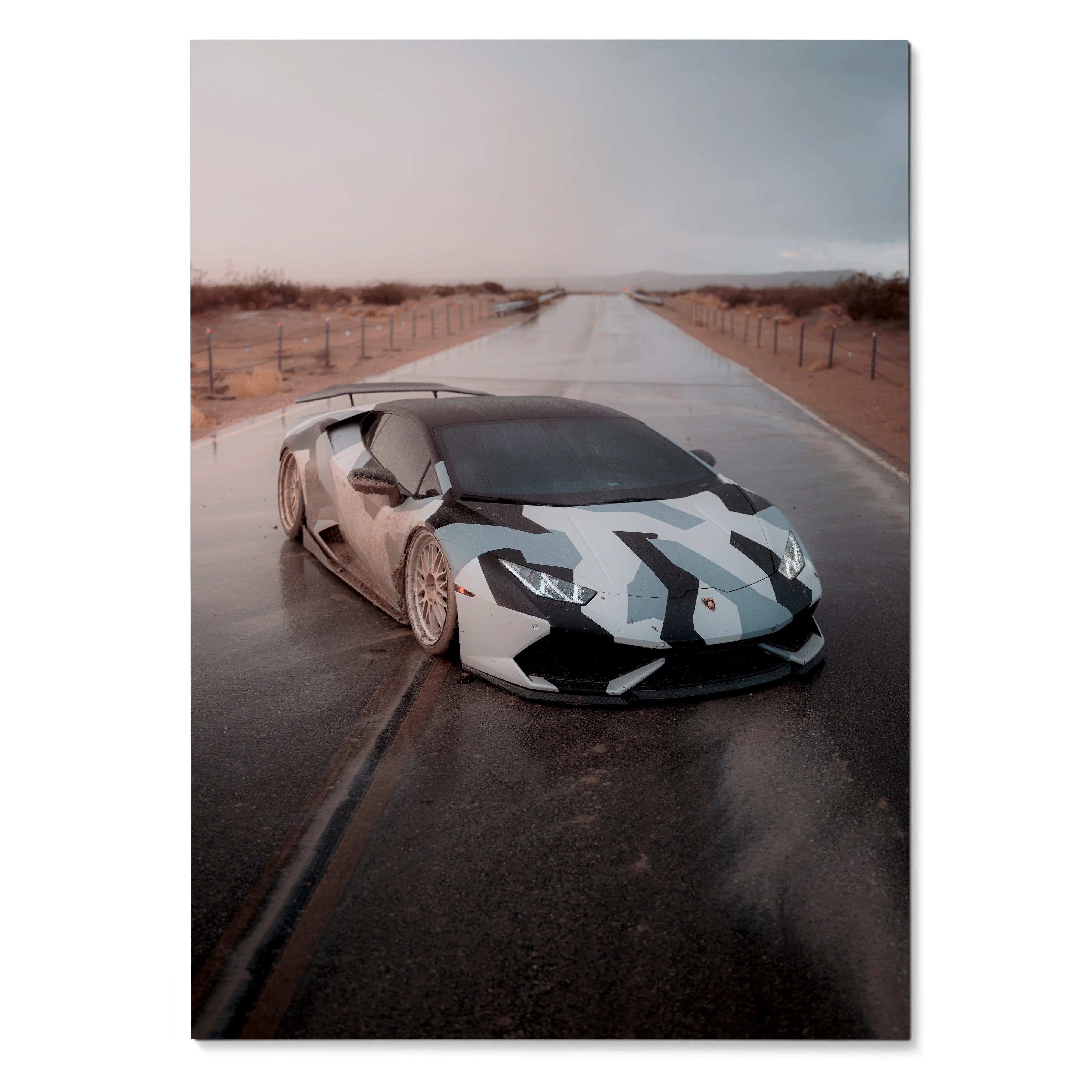 Lamborghini Huracan with white and black camouflage design on desert road poster wall art.