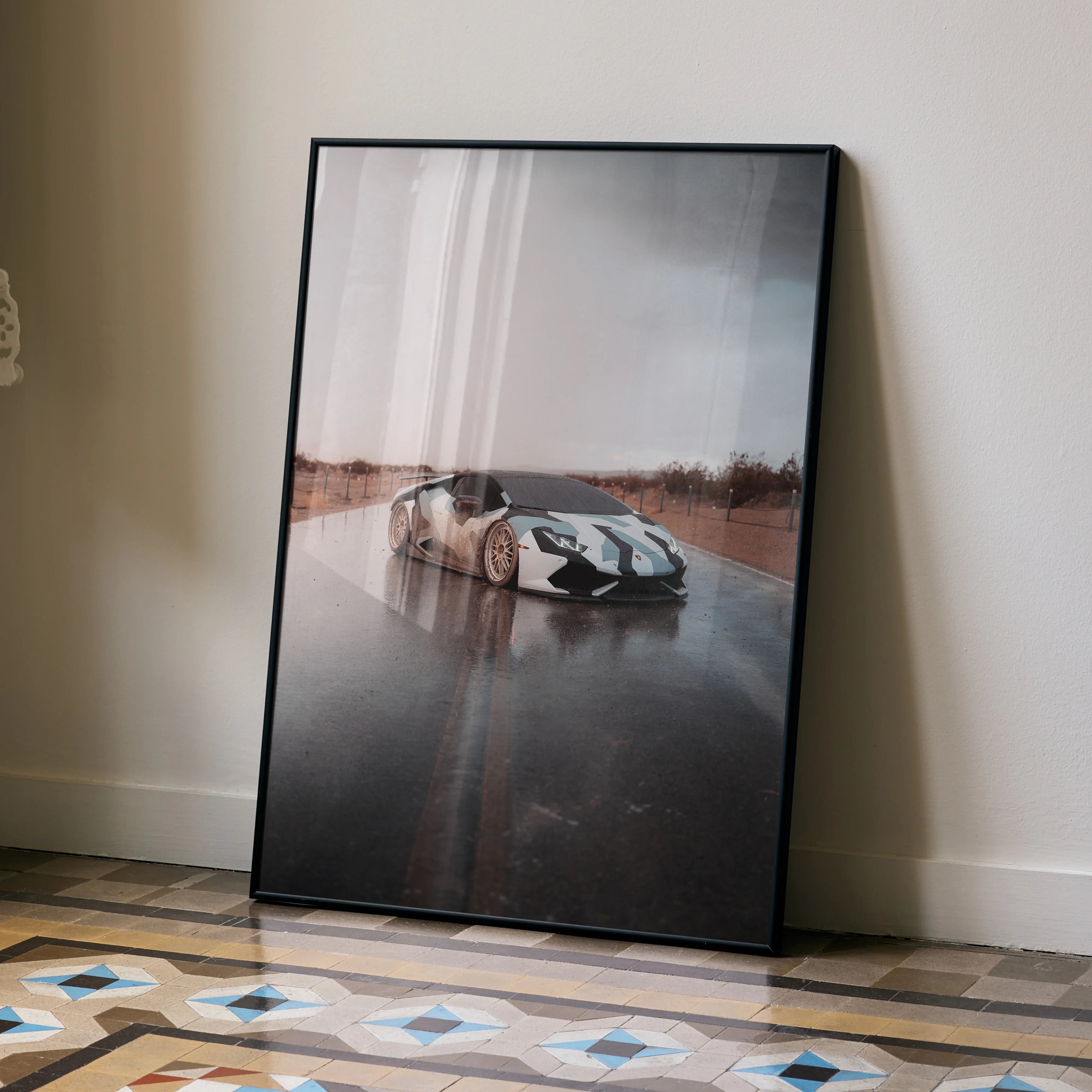 Lamborghini Huracan poster showcasing sleek silver car on reflective wet road, modern wall art.