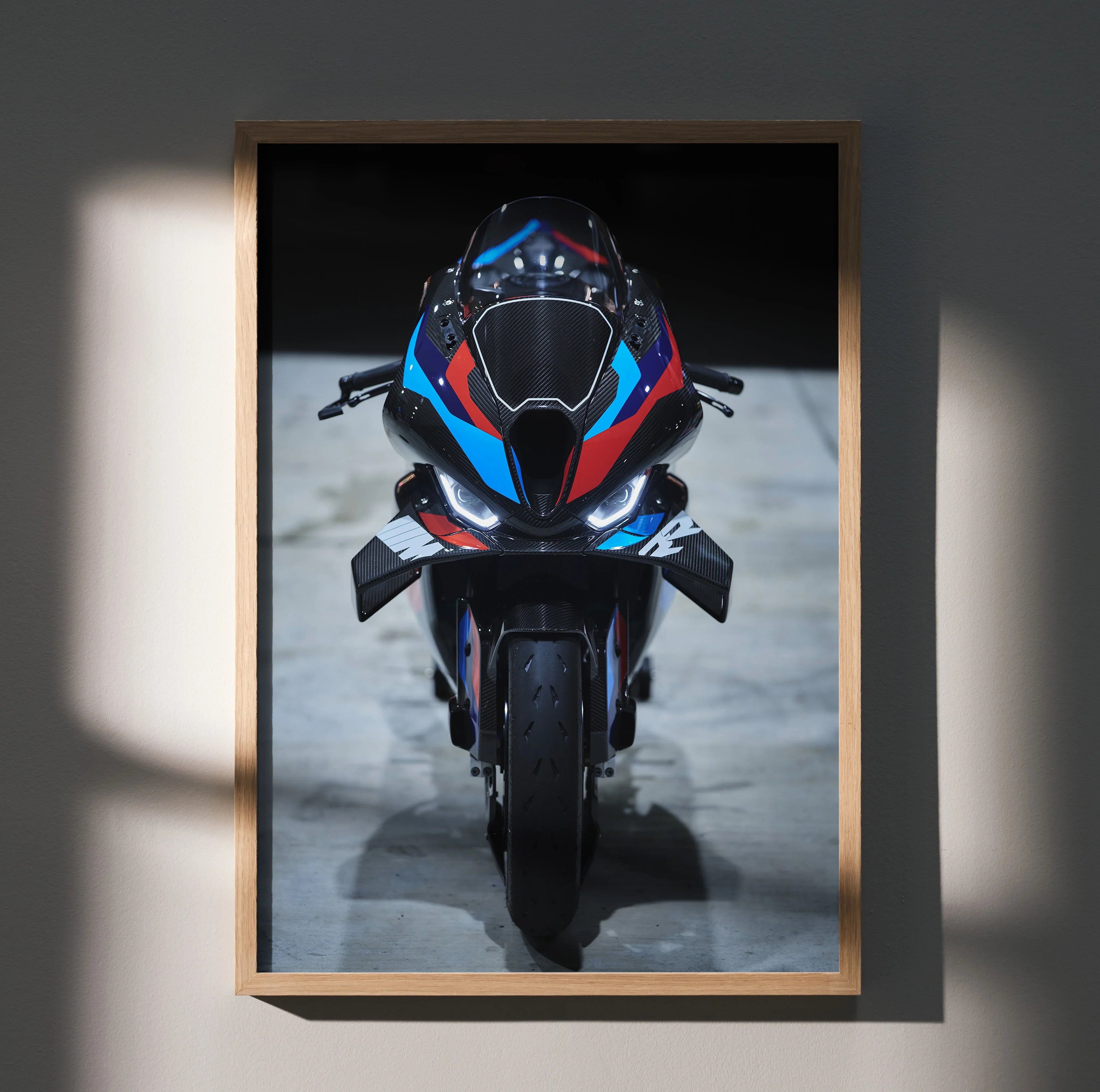 BMW M1000RR motorcycle front view poster with blue and red accents, satin wall art.