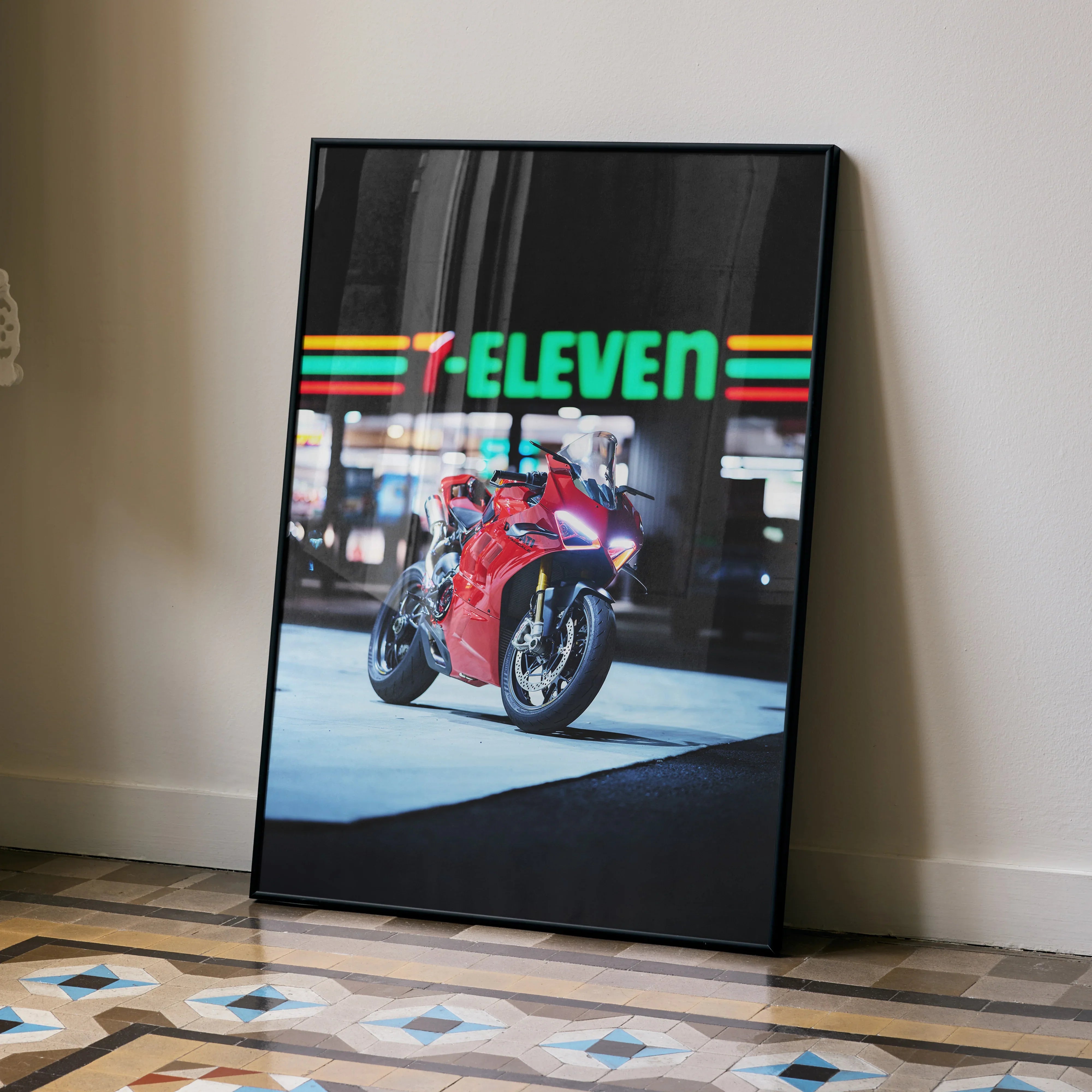 Ducati Panigale V4S poster leaning against wall with 7-Eleven neon sign and tiled floor wall art.