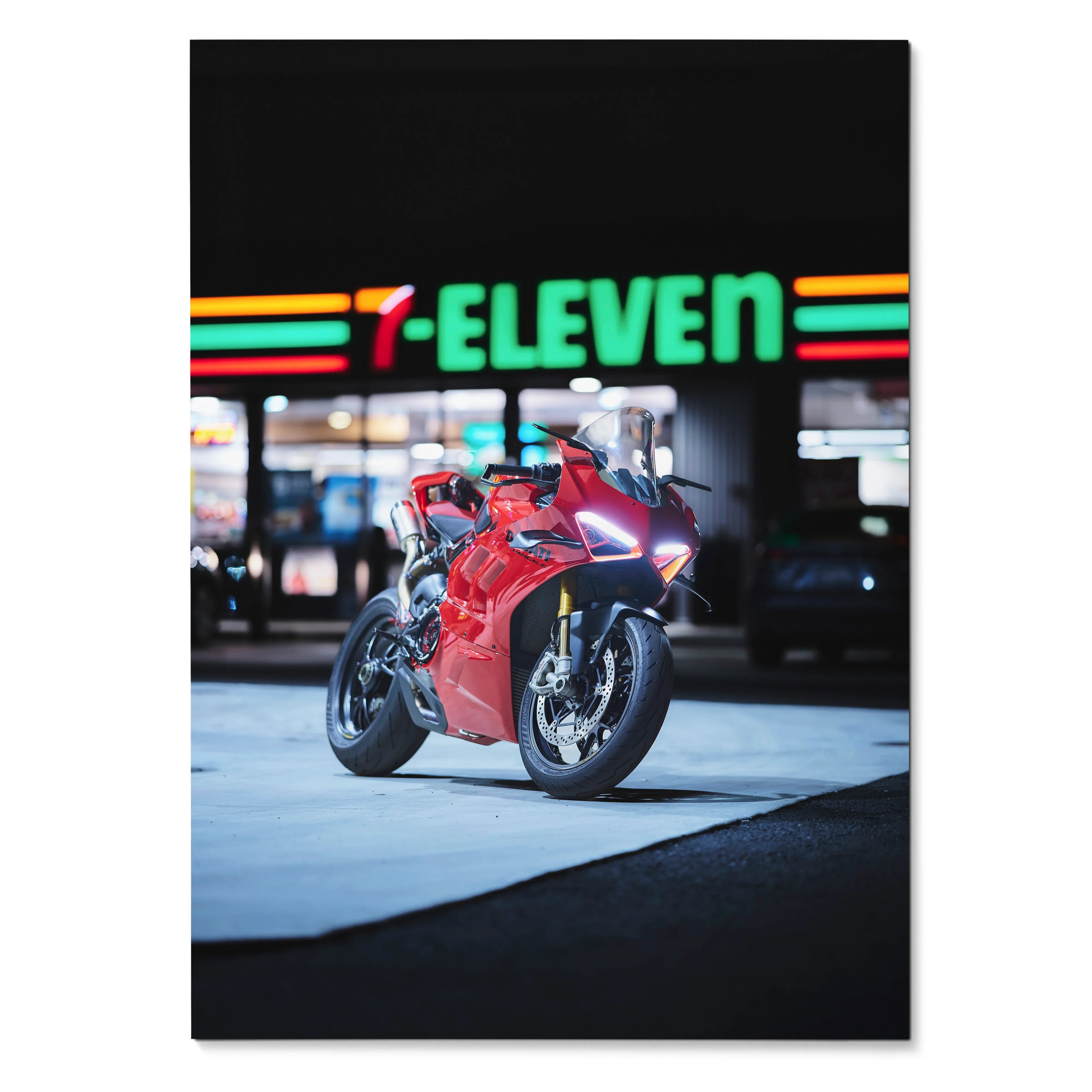 Red Ducati Panigale V4S motorcycle parked under colorful 7-Eleven sign poster wall art.