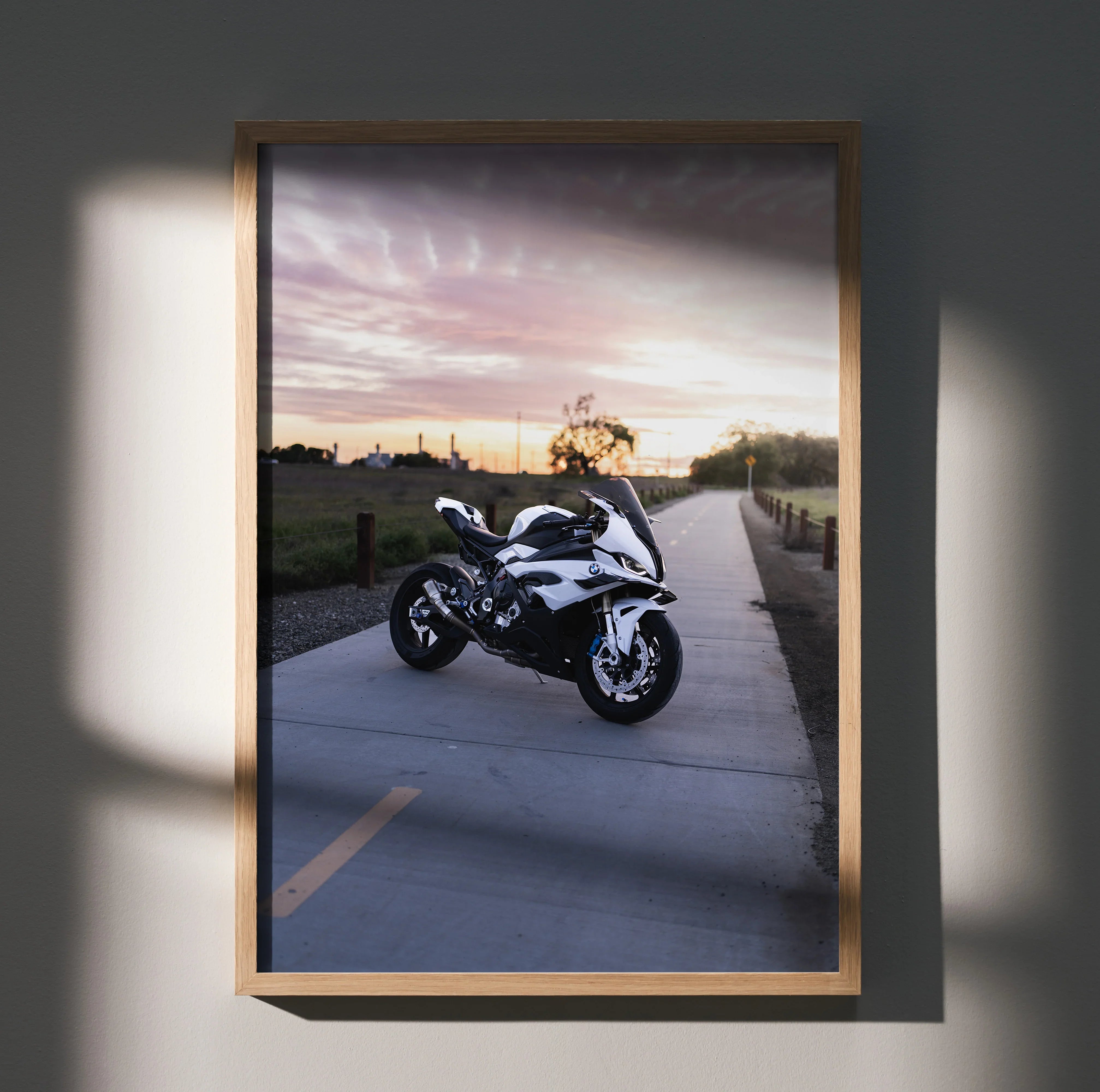 BMW S1000RR motorcycle poster with sunset background, modern wall art in wooden frame.