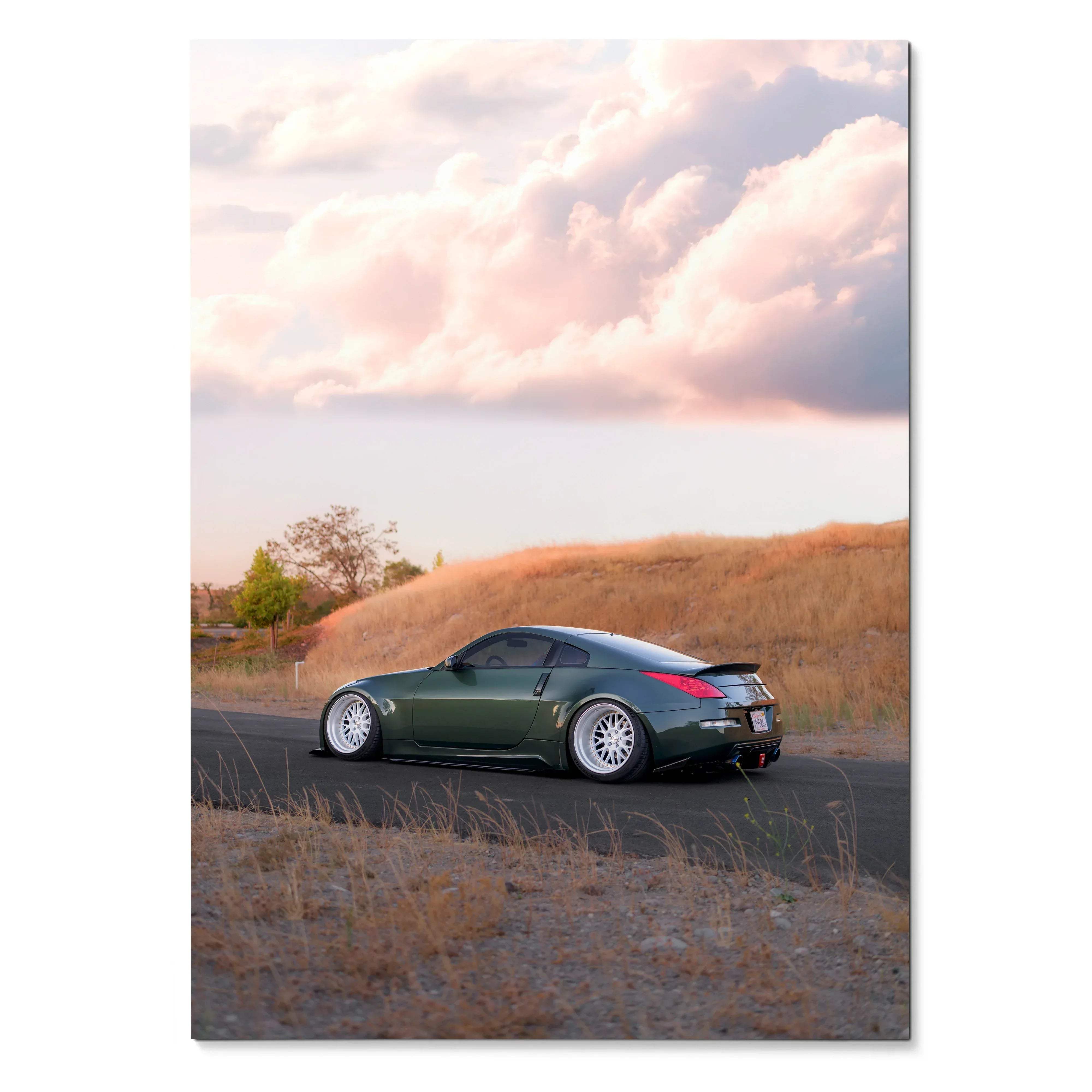 Nissan 350z parked on roadside at sunset with cloudy sky poster wall art.