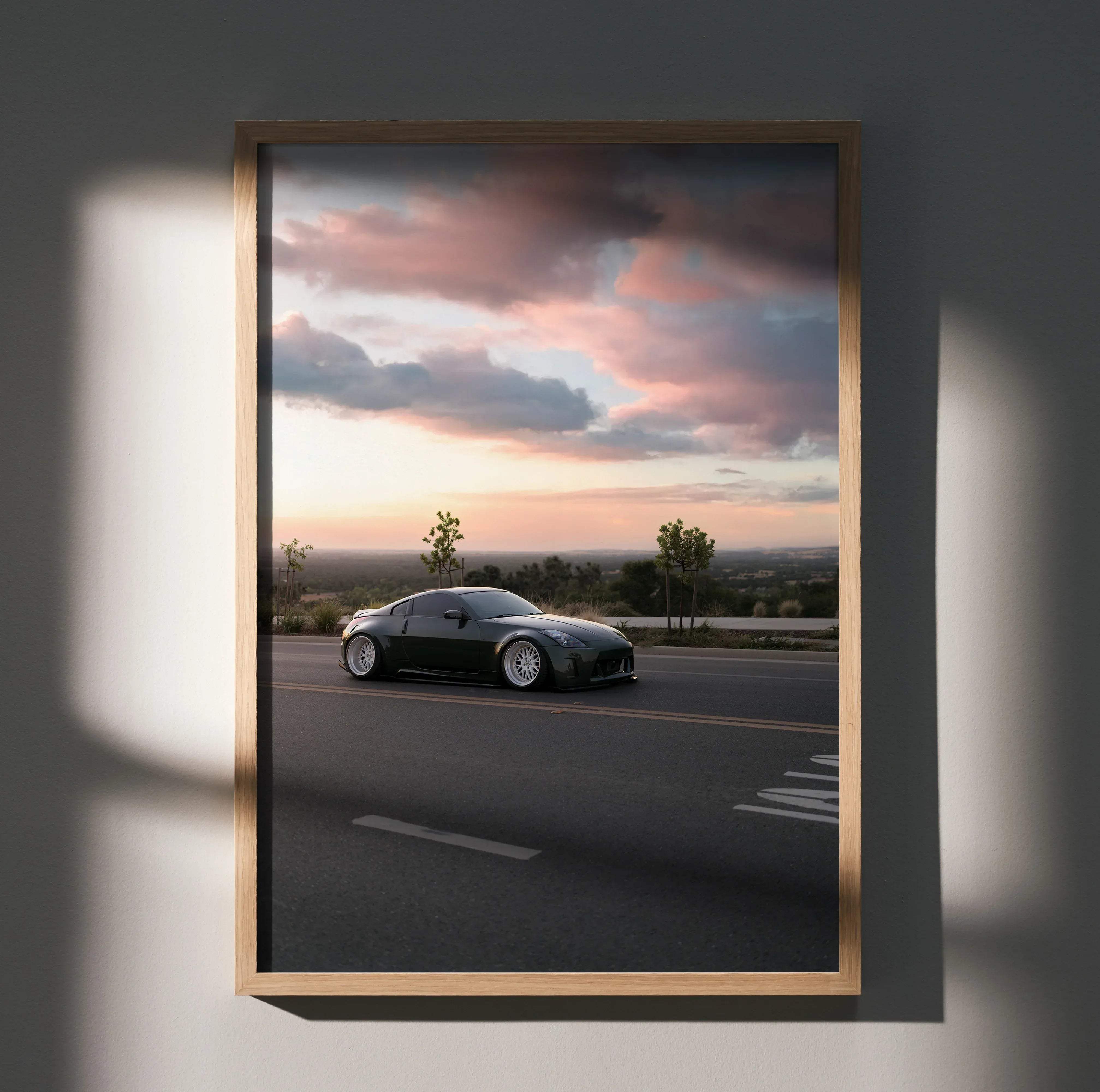 Nissan 350z high resolution car poster featuring a black sports car with white rims framed in light wood