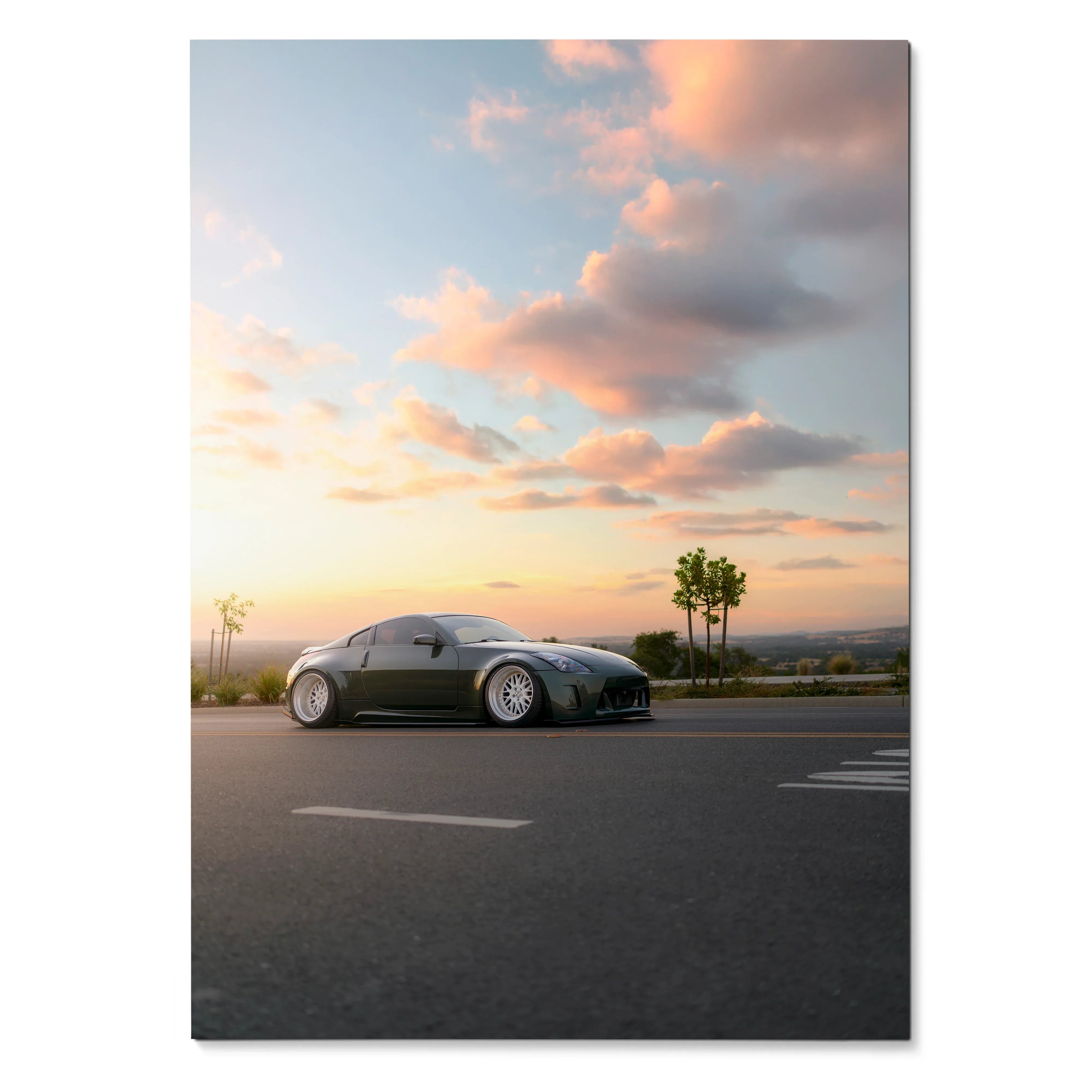 Nissan 350z on road at sunset with pink clouds poster wall art.