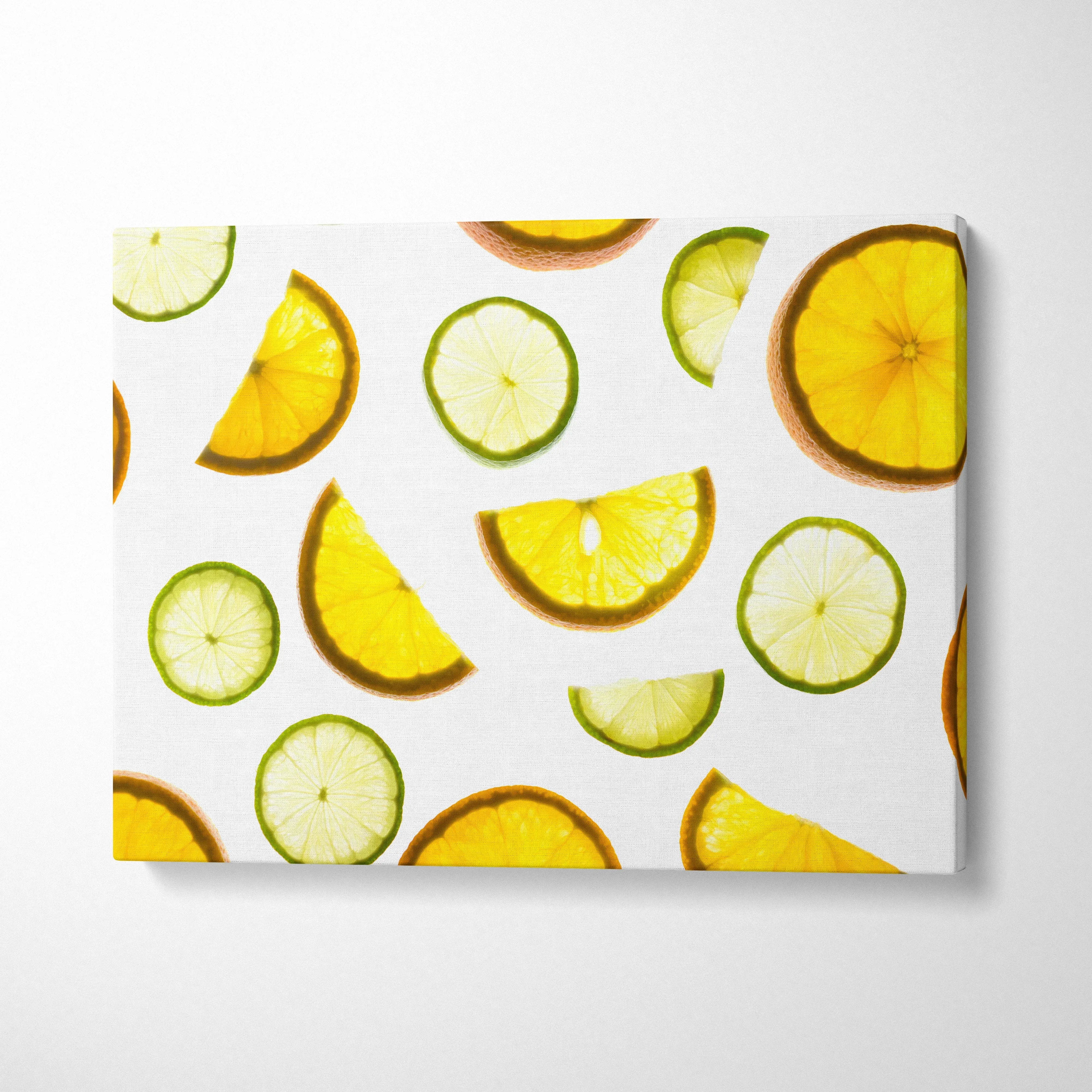 Vibrant yellow lemons and green limes pattern on canvas wall art for kitchen decor.