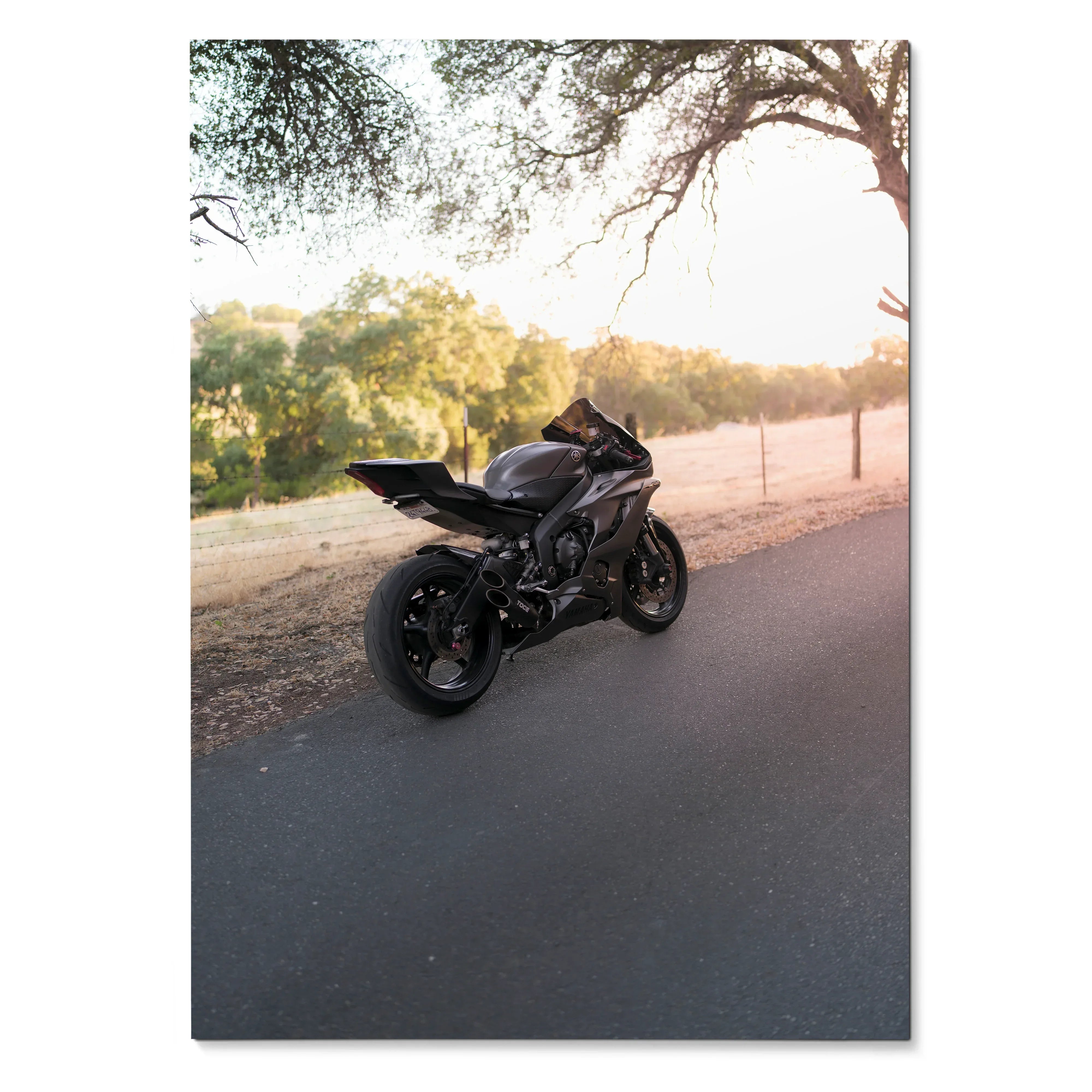Black Yamaha R6 motorcycle parked on road at sunset poster wall art.