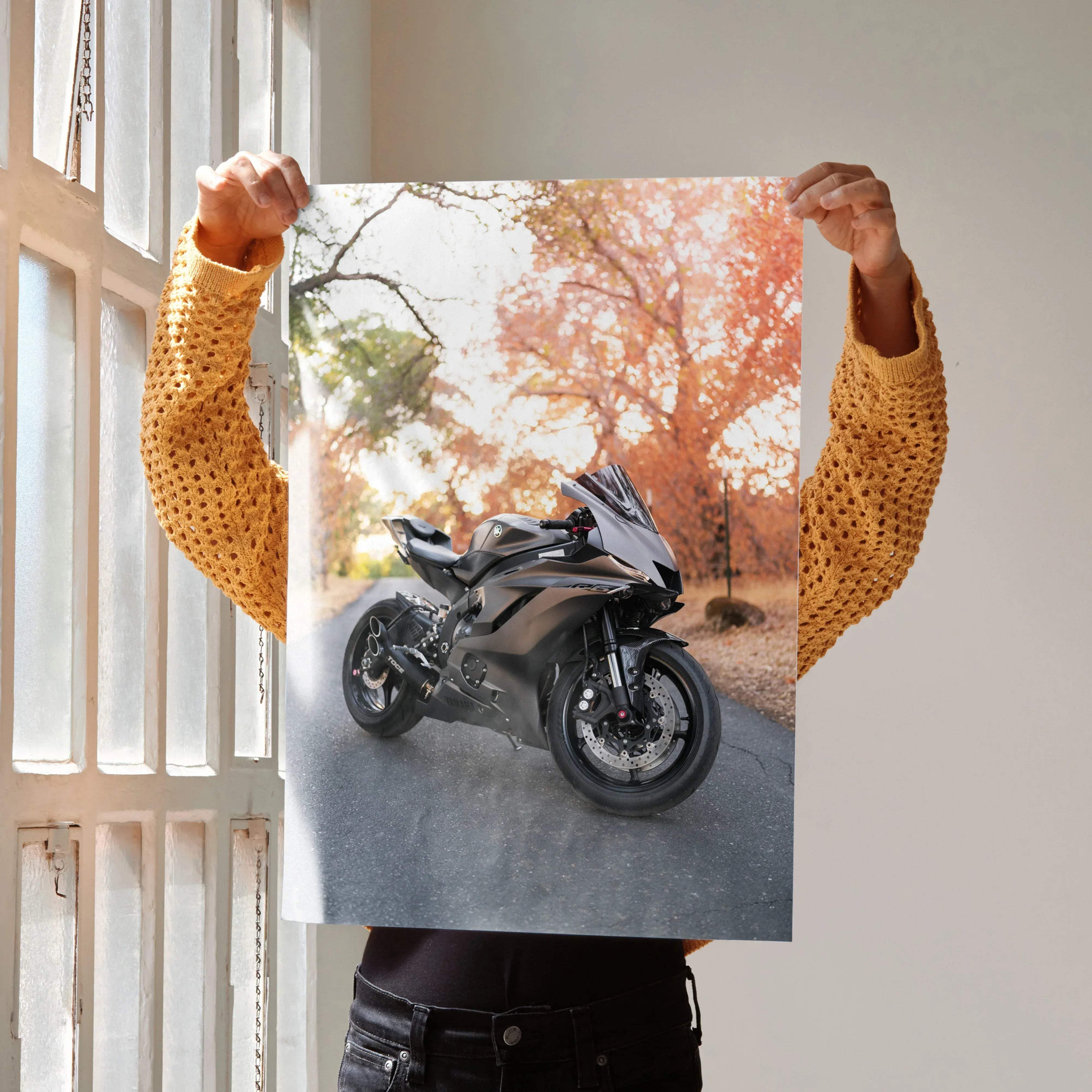A sleek black and silver Yamaha R6 motorcycle poster featuring a high-performance sport bike held in hands