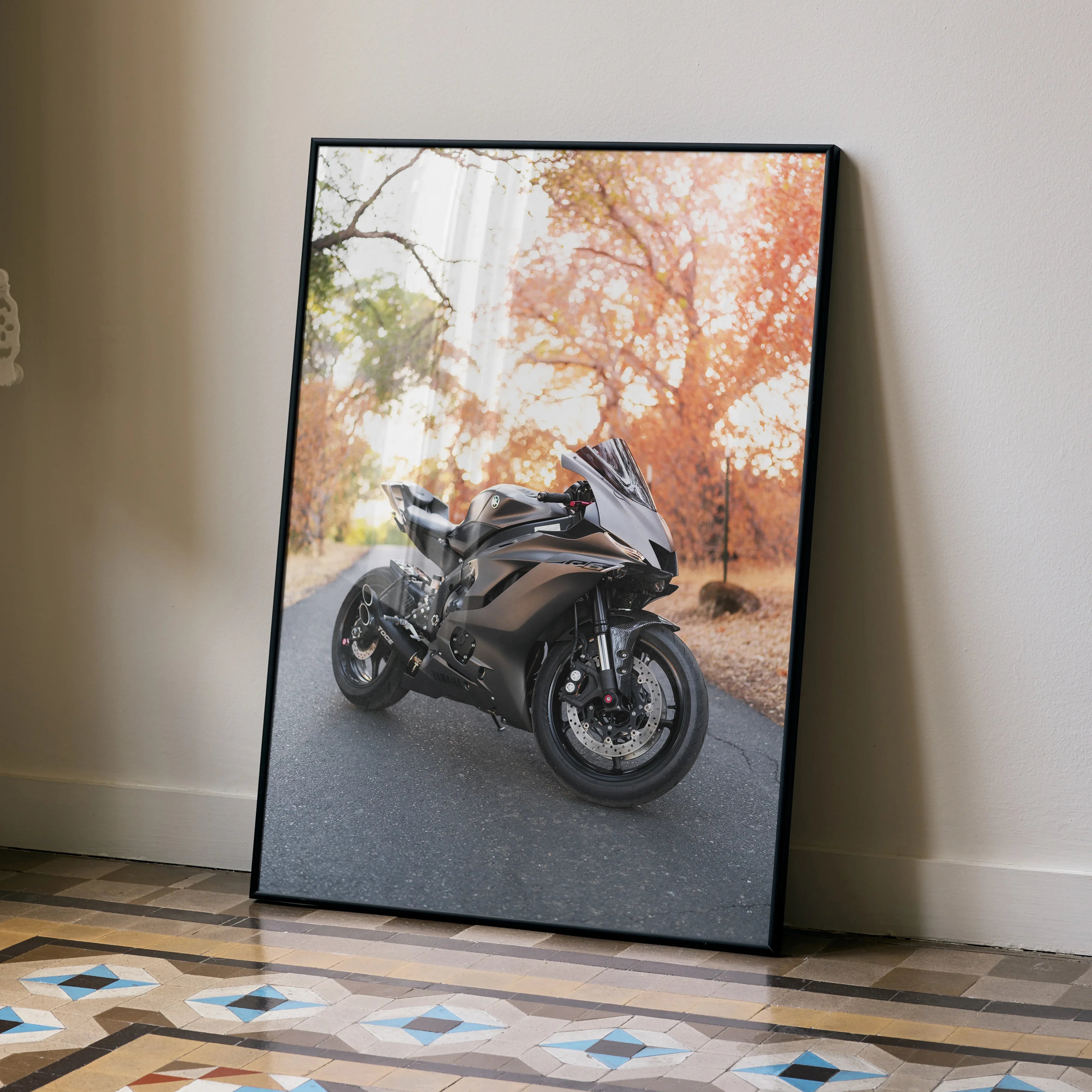 Yamaha R6 motorcycle poster with brown bike against autumn trees wall art in black frame.
